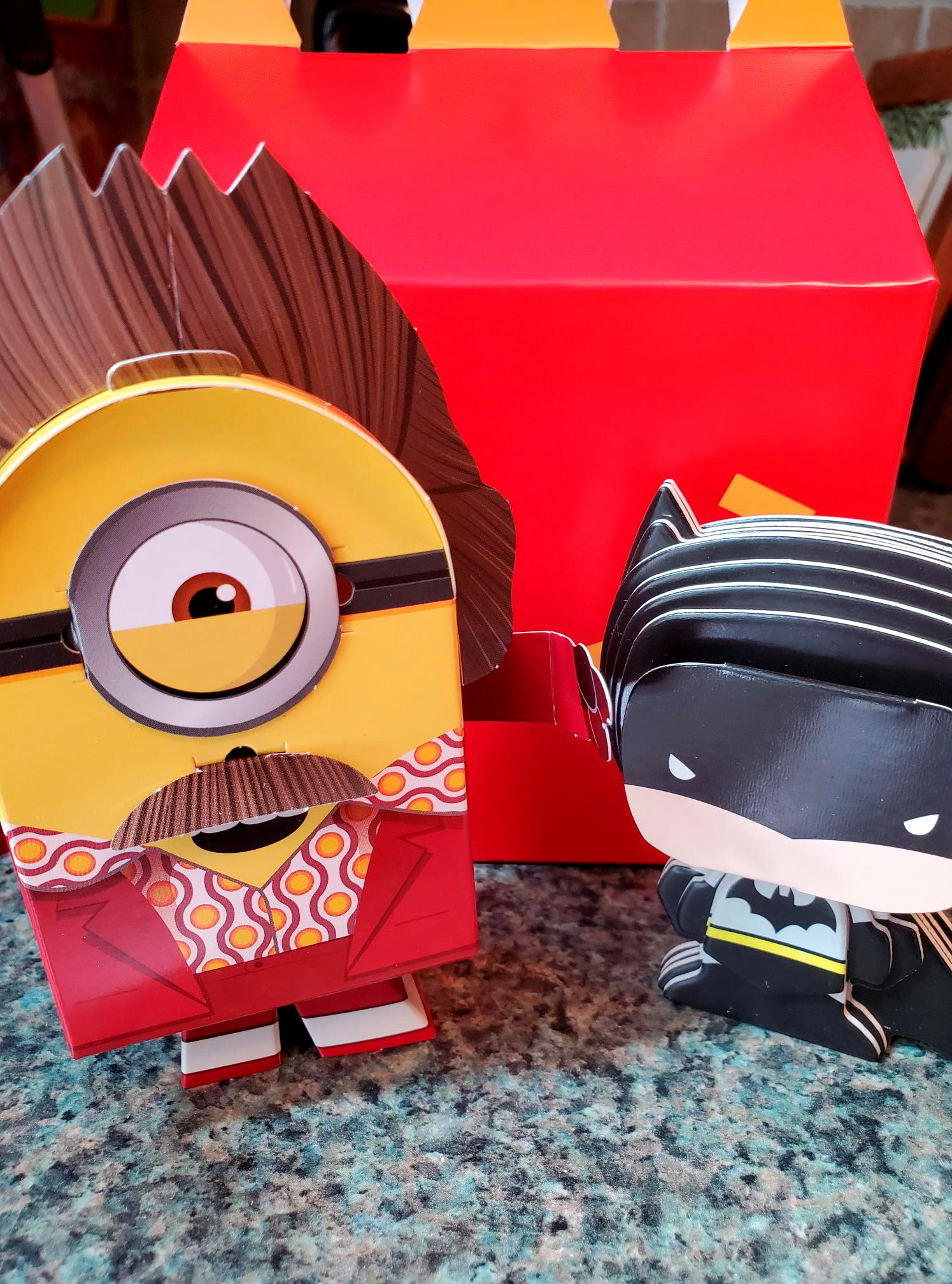 Batman and Minions toys made from paper and cardboard that children assemble themselves are seen, as McDonald's makes its future Happy Meal toys for kids more sustainable, in New York, U.S. September 20, 2021. REUTERS/Hilary Russ