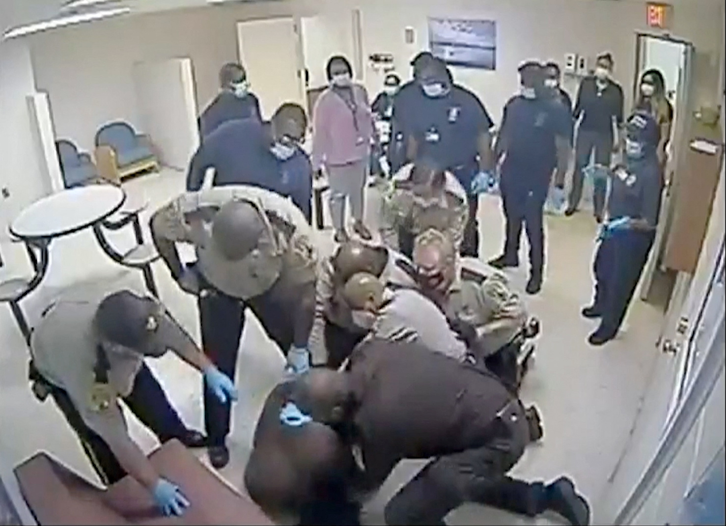 Virginia sheriff deputies wrestle with Irvo Otieno, a 28-year-old Black man, at a state mental hospital before he died, in a still image from video surveillance at Central State Hospital in Petersburg, Virginia, U.S. March 6, 2023. Dinwiddie County Commonwealth Attorney's Office/Handout via REUTERS