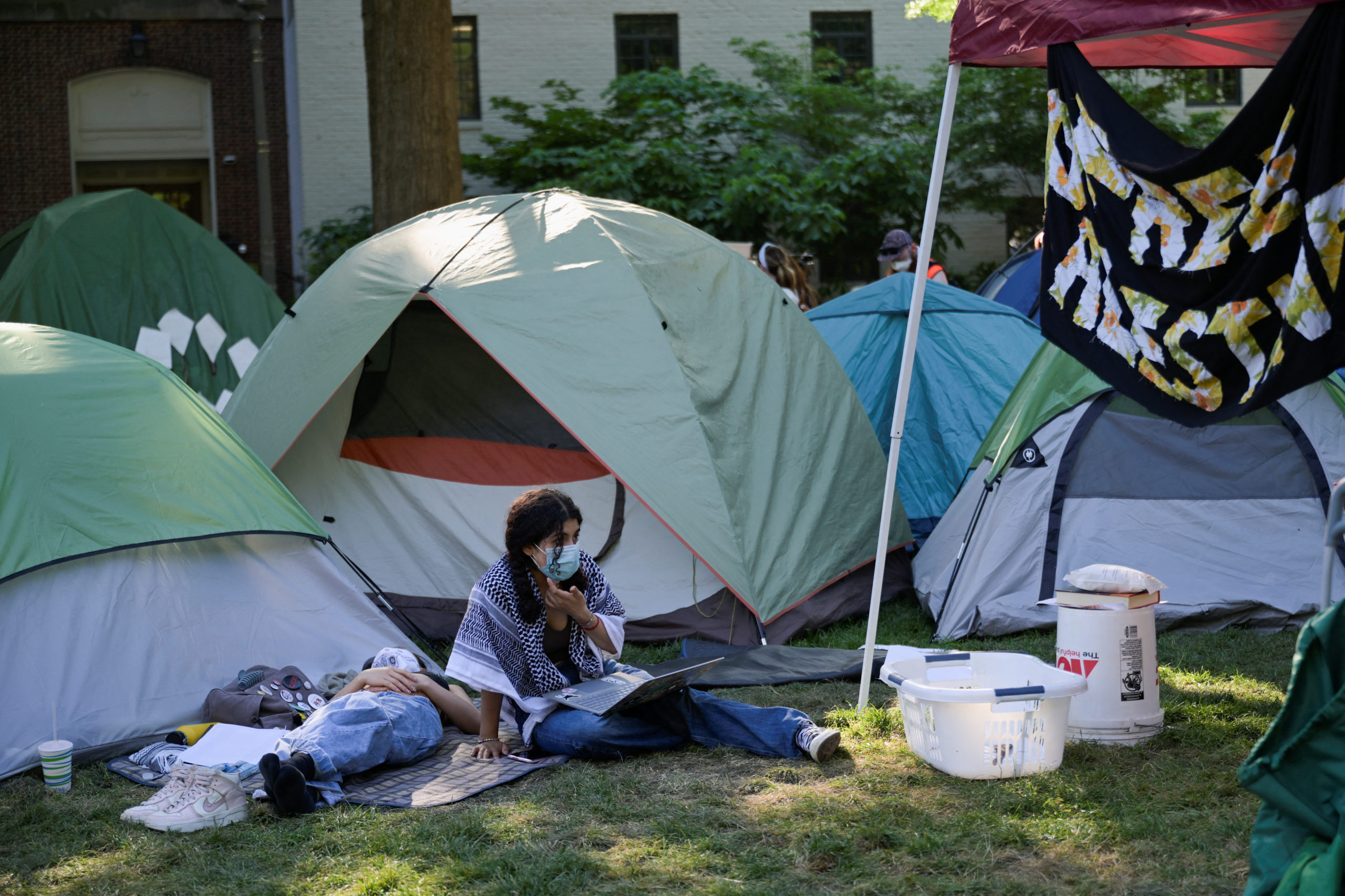 Activists rest inside a pro-Palestinian encampment at George Washington University in Washington, DC, U.S., May 2, 2024. REUTERS/Craig Hudson