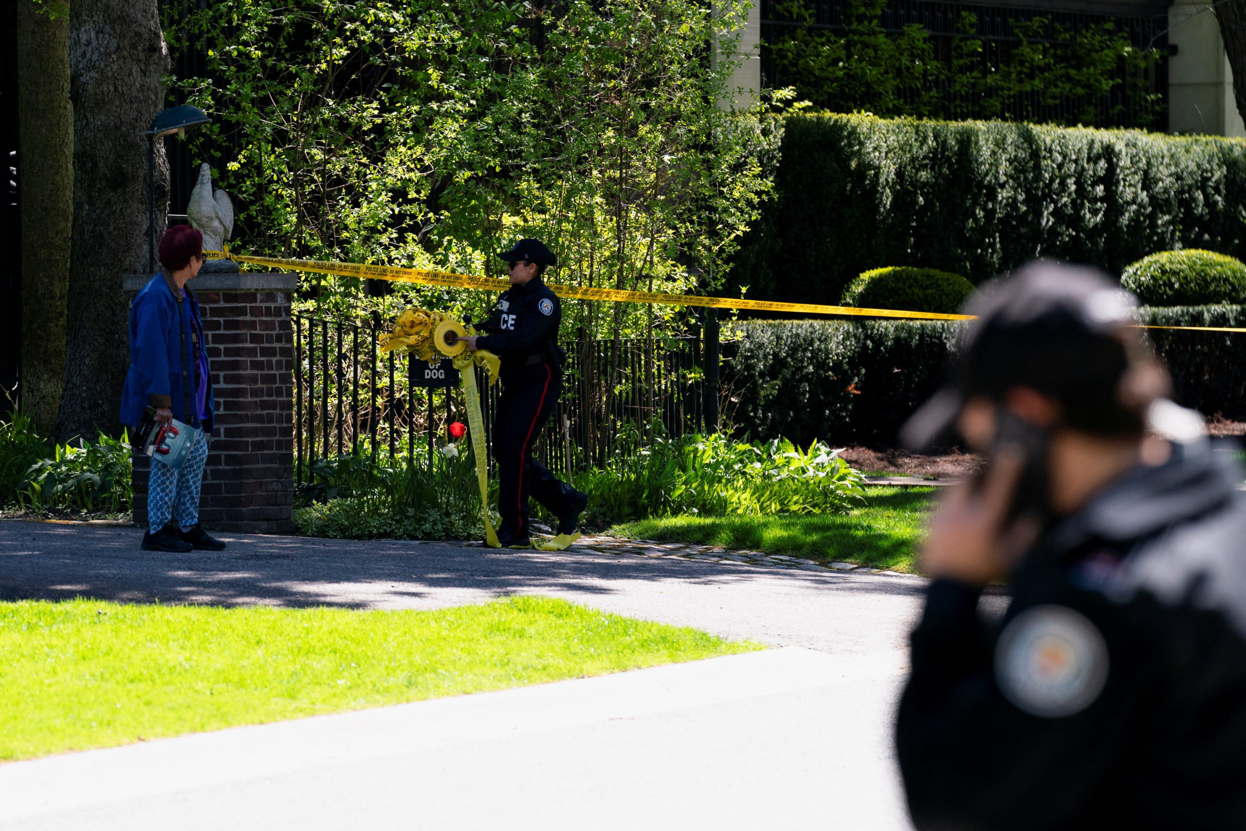 Toronto Police investigators work outside of 21 Park Lane Circle after a security guard was shot outside the Bridle Path mansion of Canadian rap star Drake in Toronto, Ontario, Canada May 7, 2024. REUTERS/Arlyn McAdorey