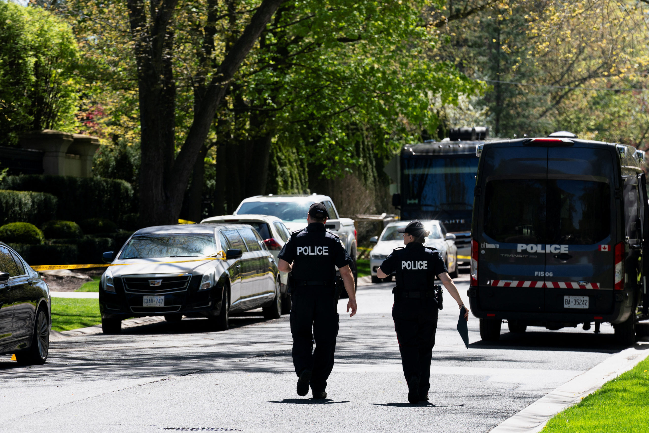 Toronto Police investigators work outside of 21 Park Lane Circle after a security guard was shot outside the Bridle Path mansion of Canadian rap star Drake in Toronto, Ontario, Canada May 7, 2024. REUTERS/Arlyn McAdorey