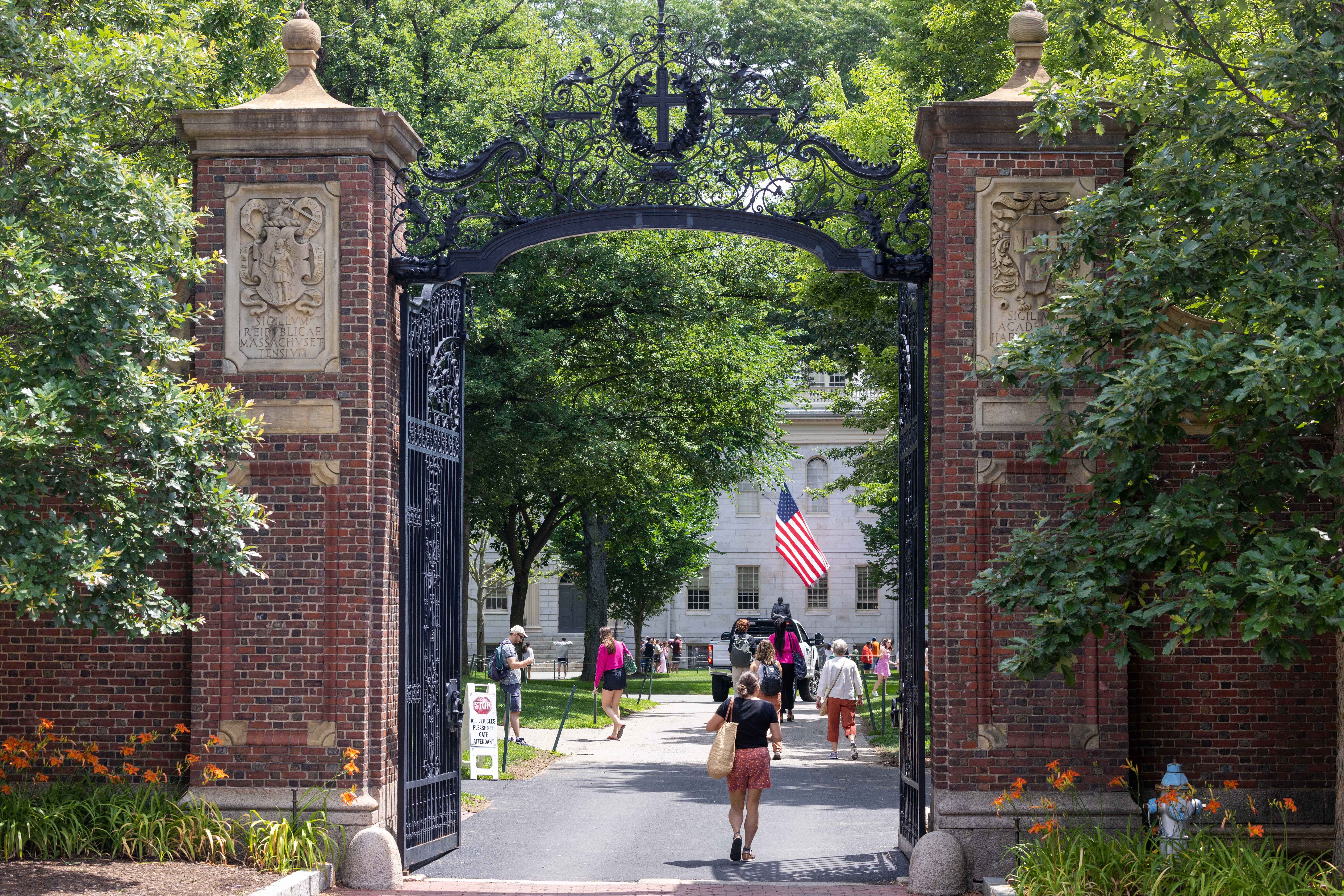 CAMBRIDGE, MASSACHUSETTS - JUNE 29: People walk through the gate on Harvard Yard at the Harvard University campus on June 29, 2023 in Cambridge, Massachusetts. The U.S. Supreme Court ruled that race-conscious admission policies used by Harvard and the University of North Carolina violate the Constitution, bringing an end to affirmative action in higher education. (Photo by Scott Eisen/Getty Images)