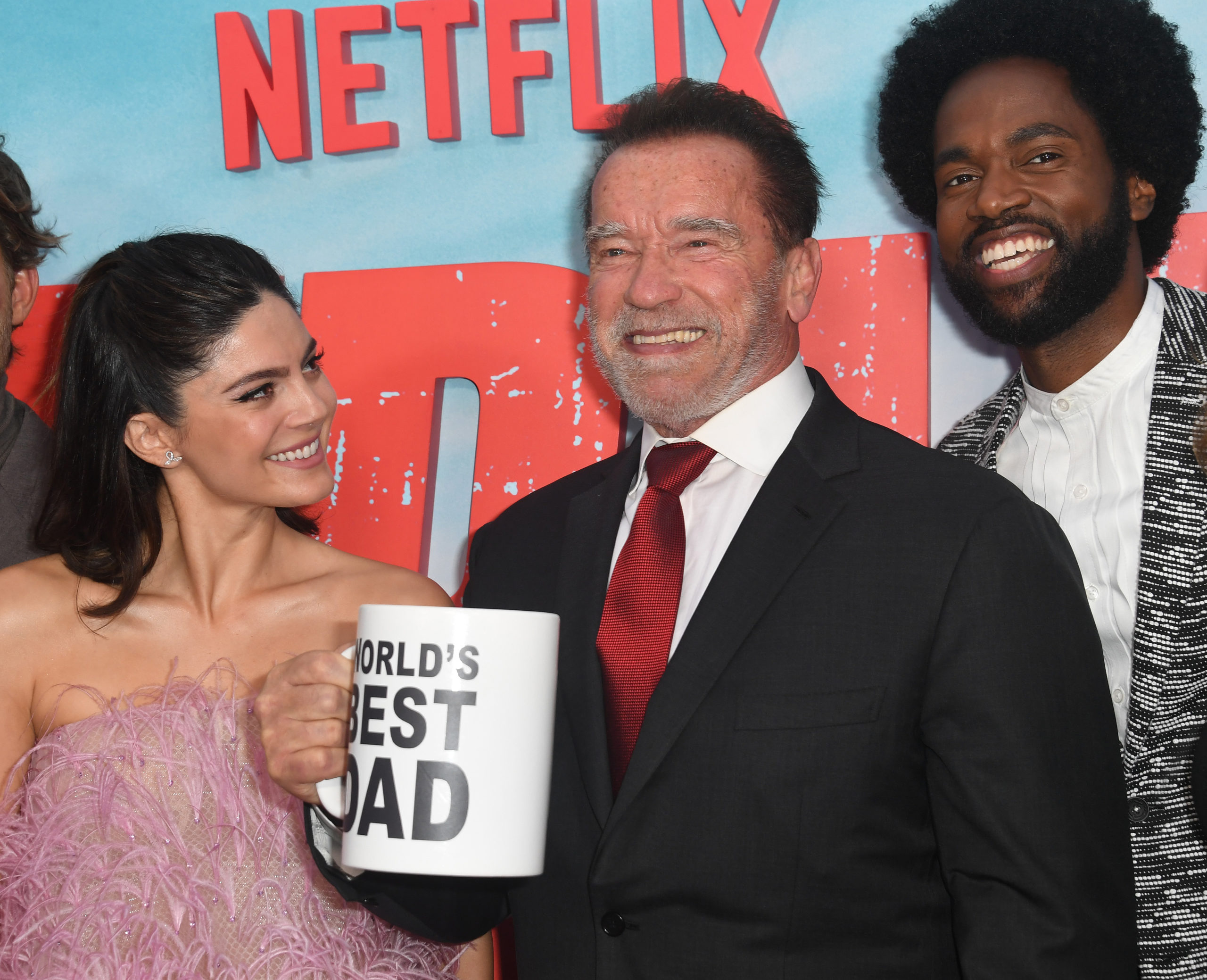 LOS ANGELES, CALIFORNIA - MAY 22: Monica Barbaro, Arnold Schwarzenegger and Milan Carter attend the Los Angeles Premiere Of Netflix's "FUBAR" held at The AMC Grove on May 22, 2023 in Los Angeles, California. (Photo by Albert L. Ortega/Getty Images)