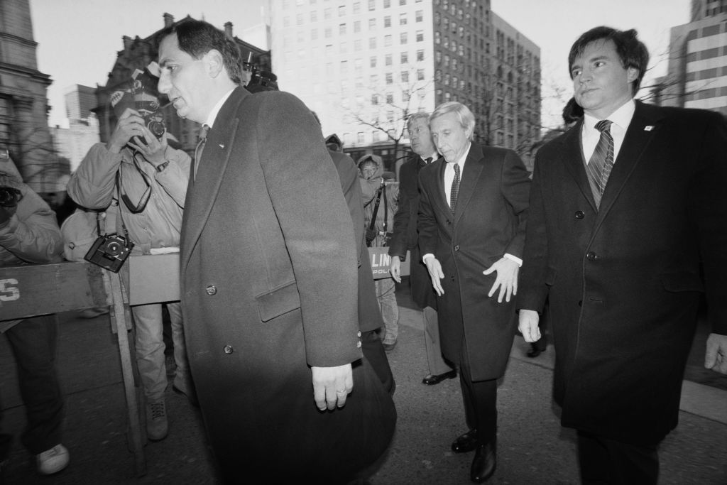 American stock trader Ivan Boesky (white hair) arrives at the Manhattan Federal Court, New York City, charged with insider trading, December 1987. He received a sentence of 3.5 years and a 100 million dollar fine after plea bargaining. (Photo by Michael Brennan/Getty Images)