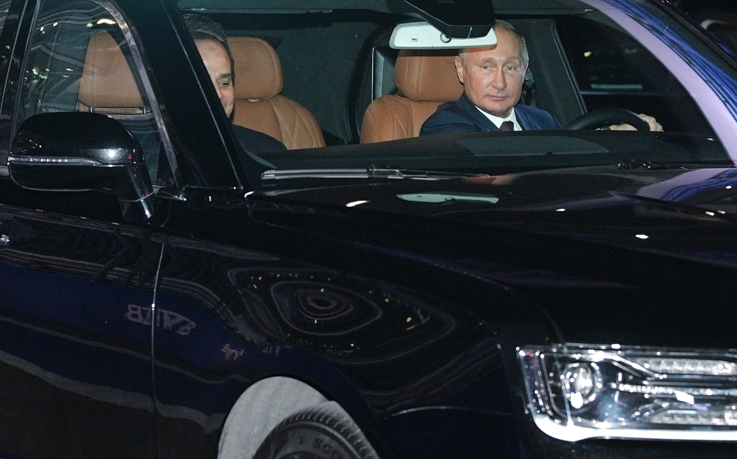 Russian President Vladimir Putin (R) drives the Aurus presidential limousine as Egyptian President Abdel Fattah el-Sisi (L) sits next to him at the Sochi's F1 race track on October 17, 2018. ALEXEI DRUZHININ/AFP via Getty Images