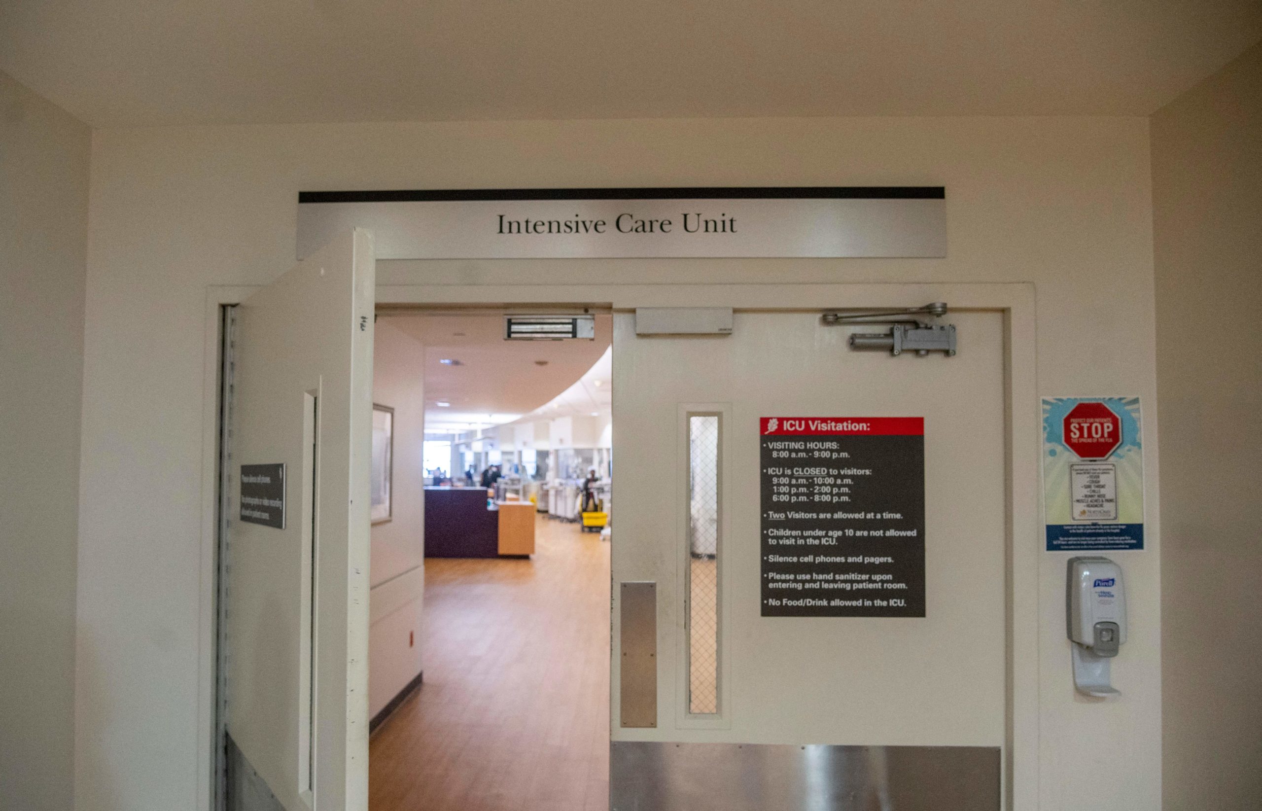 The entrance of the Intensive Care Unit inside in North Oaks Hospital is seen in Hammond, Louisiana, on August 13, 2021. - Barely clinging to life, patients in an intensive care unit in Hammond, Louisiana, lie in their beds, gray and emaciated, their faces marked by the tight grip of respirators and the ravages of Covid-19. As cases soar due to the more contagious Delta variant, medical units like the North Oaks Hospital are overwhelmed. Half of the Covid patients there are critical. (Photo by EMILY KASK/AFP via Getty Images)