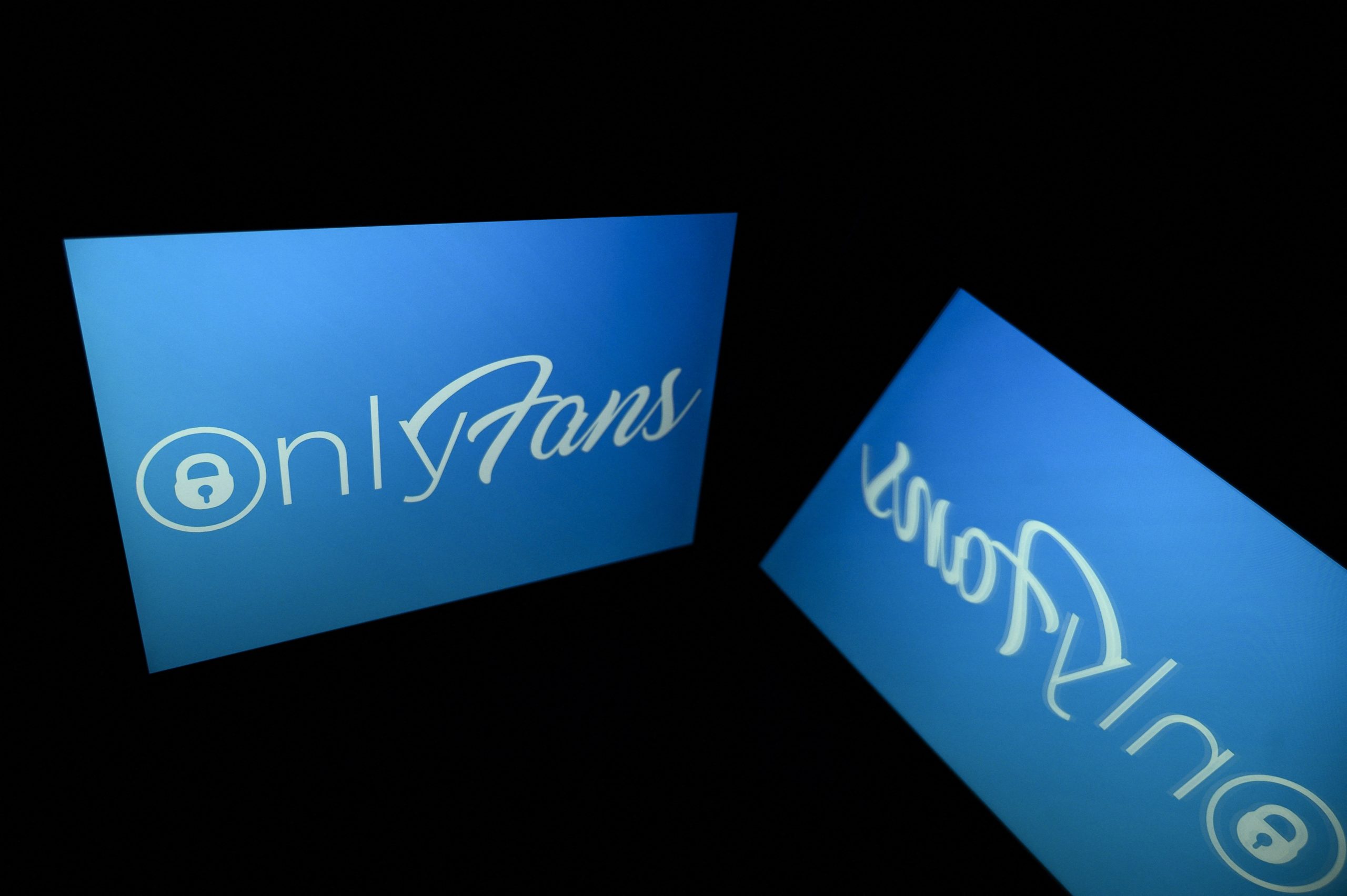 A picture taken on October 5, 2021 in Toulouse shows the logo of Onlyfans social media displayed by a tablet. (Photo by LIONEL BONAVENTURE/AFP via Getty Images)