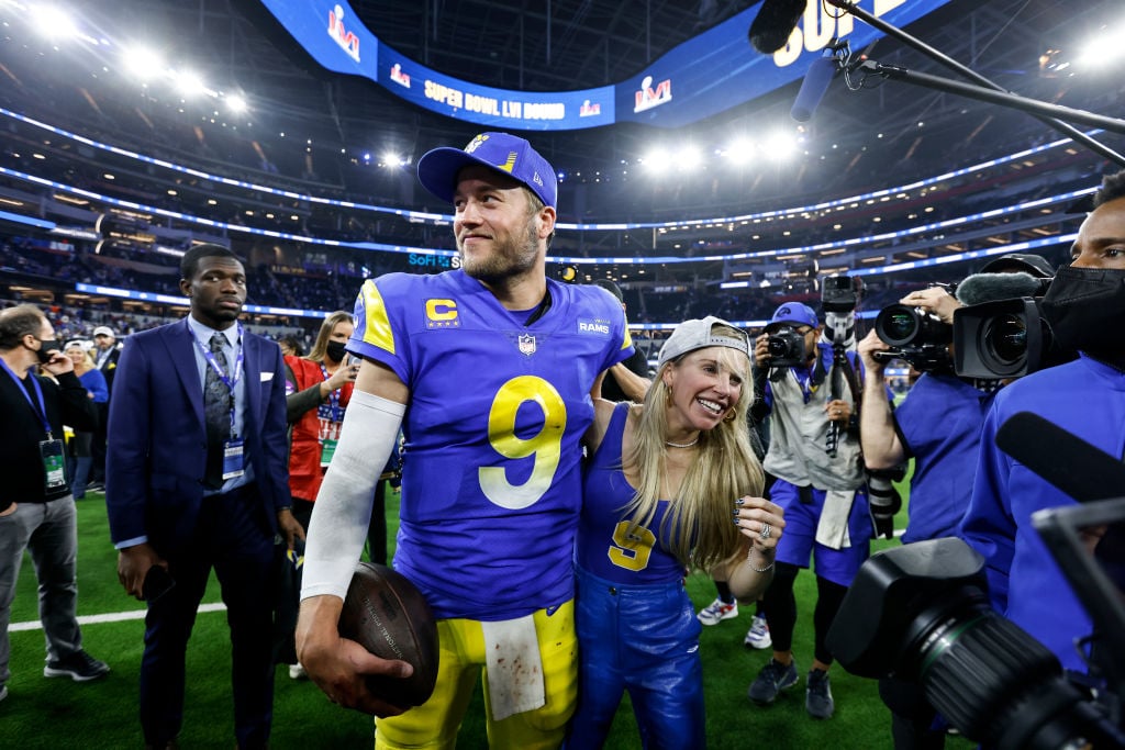 INGLEWOOD, CALIFORNIA - JANUARY 30: Matthew Stafford #9 of the Los Angeles Rams celebrates with his wife, Kelly Hall, following the NFC Championship NFL football game against the San Francisco 49ers at SoFi Stadium on January 30, 2022 in Inglewood, California. The Rams won 20-17 to advance to the Super Bowl. (Photo by Michael Owens/Getty Images)