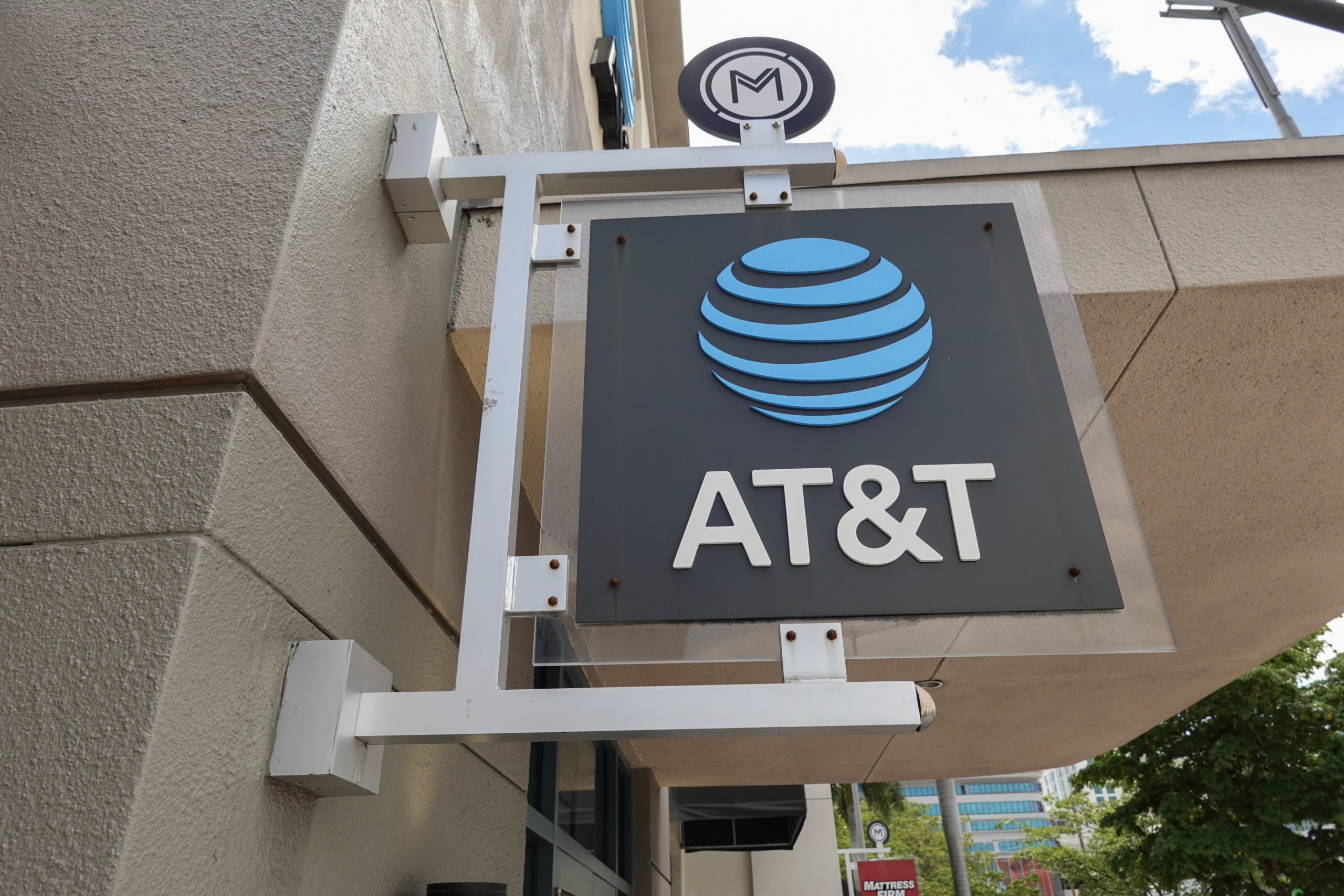 MIAMI, FLORIDA - APRIL 01: An AT&T sign hangs outside of a store on April 01, 2024, in Miami, Florida. AT&T acknowledged a massive leak involving the data of 73 million current and former subscribers. They reported that they had reset passcodes for millions of customers after the hack. (Photo by Joe Raedle/Getty Images)