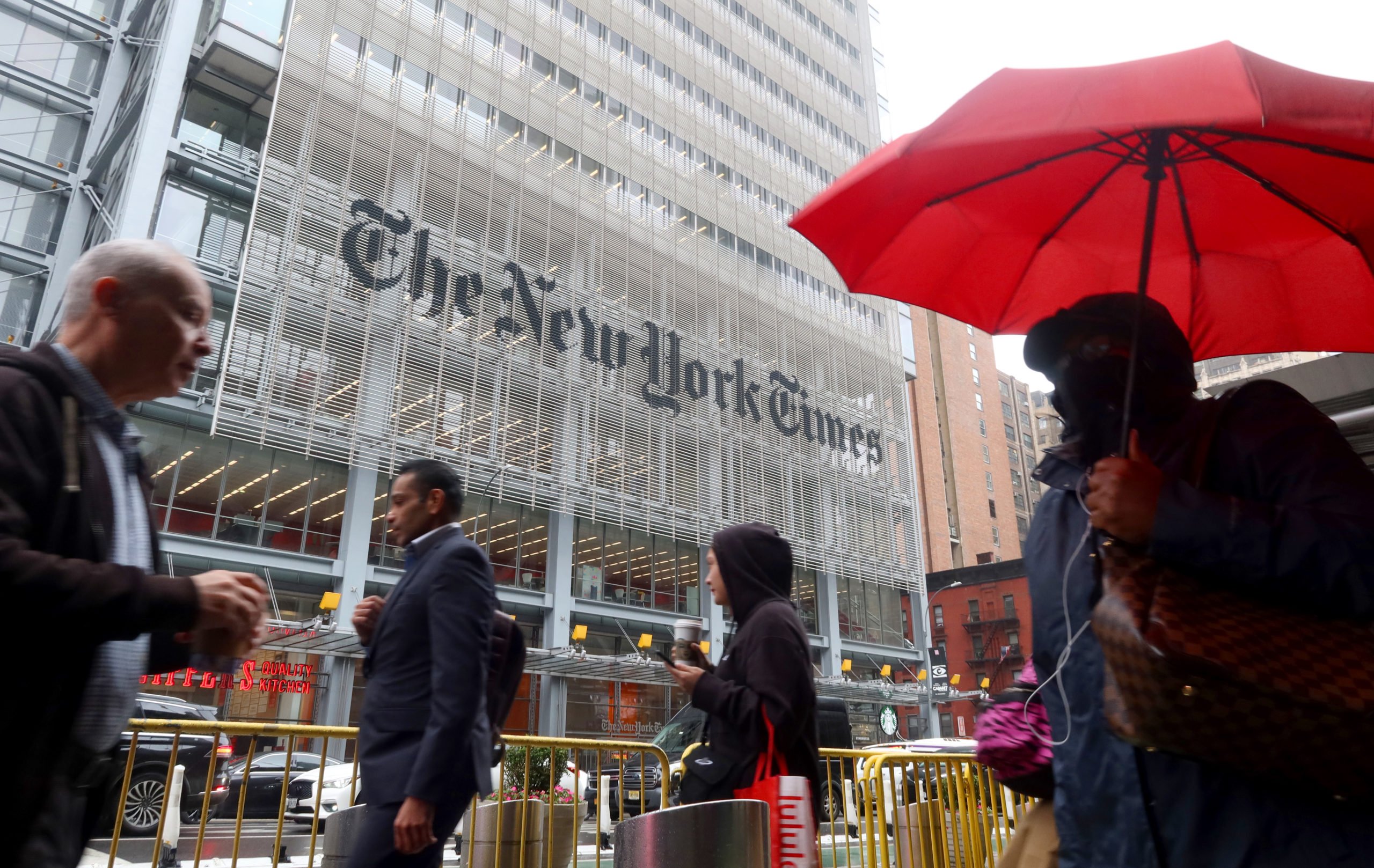 NEW YORK, NY - MAY 16: People walk past the New York Times headquarters on 8th Avenue on May 16, 2024, in New York City. Gary Hershorn/Getty Images