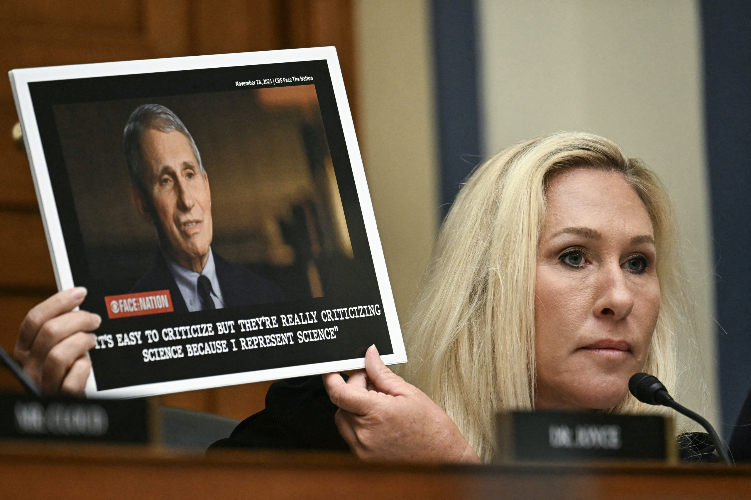 US Representative Marjorie Taylor-Greene, Republican of Georgia, holds up an image of Dr. Anthony Fauci, former director of the National Institute of Allergy and Infectious Diseases, as she questions him during a House Select Subcommittee on the Coronavirus Pandemic hearing on Capitol Hill, in Washington, DC, June 3, 2024. JIM WATSON/AFP via Getty Images