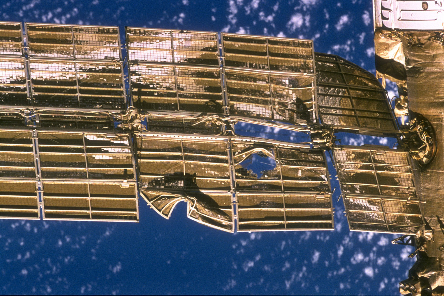 383927 13: FILE PHOTO: A close-up view of the solar array panel on Russia's Mir Space Station's Spektr Module shows damage incurred by the impact of a Russian unmanned Progress re-supply ship which collided with the space station June 25, 1997, causing Spektr to depressurize. Mir is nearing the end of its existence as Russia plans to steer the craft out of orbit in late February 2001 in a controlled crash to dump the space station safely into the Pacific Ocean. (Photo by NASA/Newsmakers)