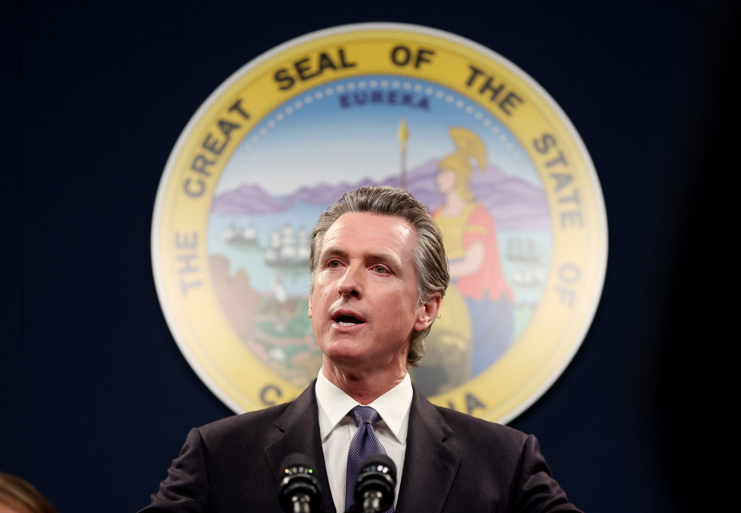 SACRAMENTO, CALIFORNIA - FEBRUARY 01: California Gov. Gavin Newsom speaks during a press conference on February 01, 2023 in Sacramento, California. California Gov. Gavin Newsom, state Attorney General Rob Bonta, state Senator Anthony Portantino (D-Burbank) and other state leaders announced SB2 - a new gun safety legislation that would establish stricter standards for Concealed Carry Weapon (CCW) permits to carry a firearm in public. The bill designates "sensitive areas," like bars, amusement parks and child daycare centers where guns would not be allowed. (Photo by Justin Sullivan/Getty Images)