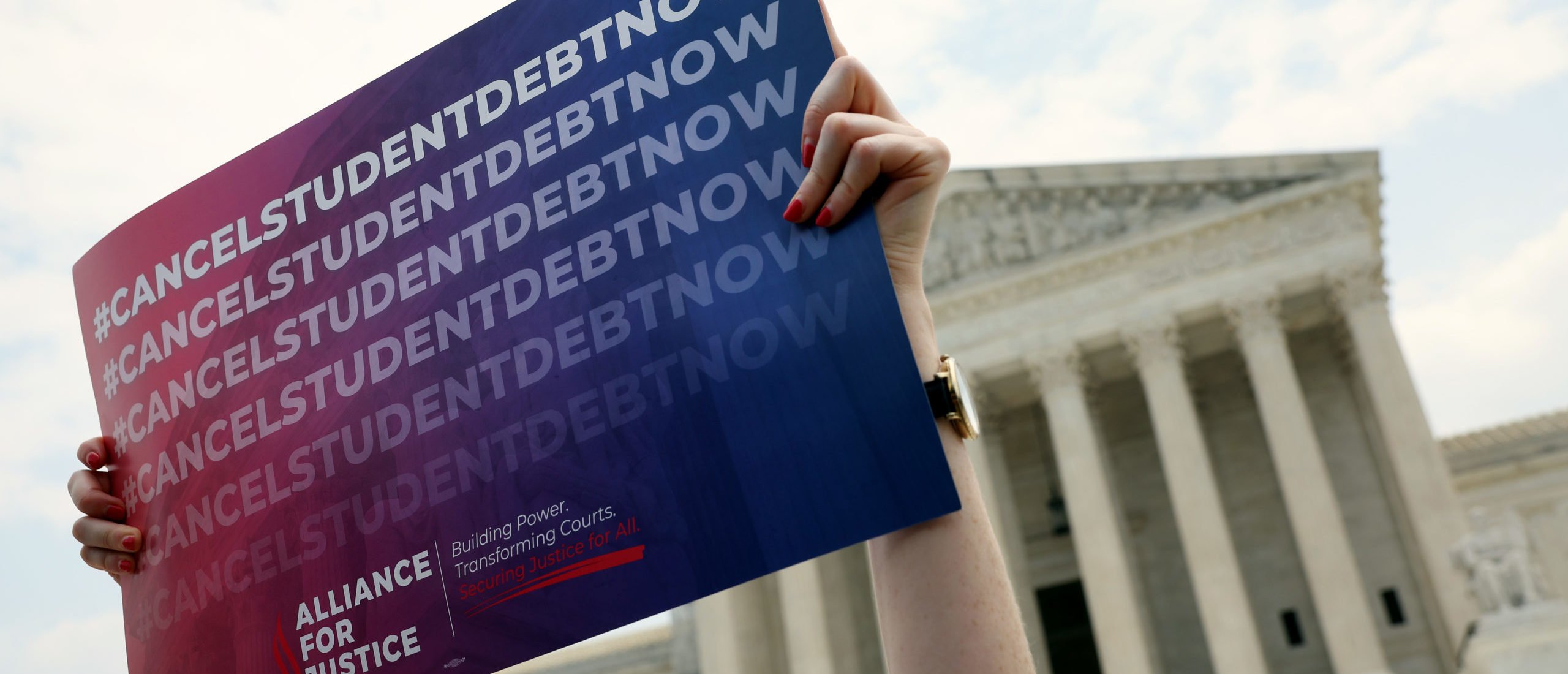 WASHINGTON, DC - JUNE 30: A Student debt relief activist participates in a student debt rally at the U.S. Supreme Court on June 30, 2023 in Washington, DC. In a 6-3 decision the Supreme Court stuck down the Biden administration’s student debt forgiveness program in Biden v. Nebraska. (Photo by Kevin Dietsch/Getty Images)