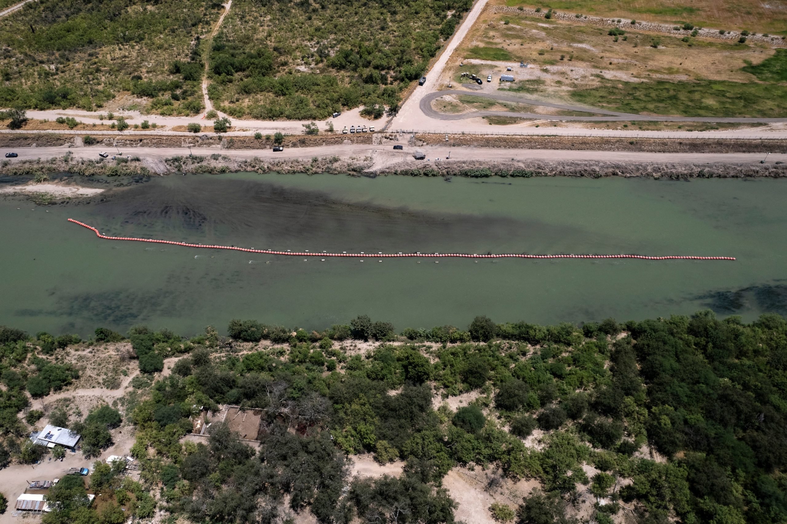 A floating barrier to deter migrants from crossing the Grand River into the United States through Eagle Pass, Texas is seen from Piedras Negras, Coahuila state, Mexico on August 4, 2023. (Photo by Guillermo Arias / AFP) (Photo by GUILLERMO ARIAS/AFP via Getty Images)