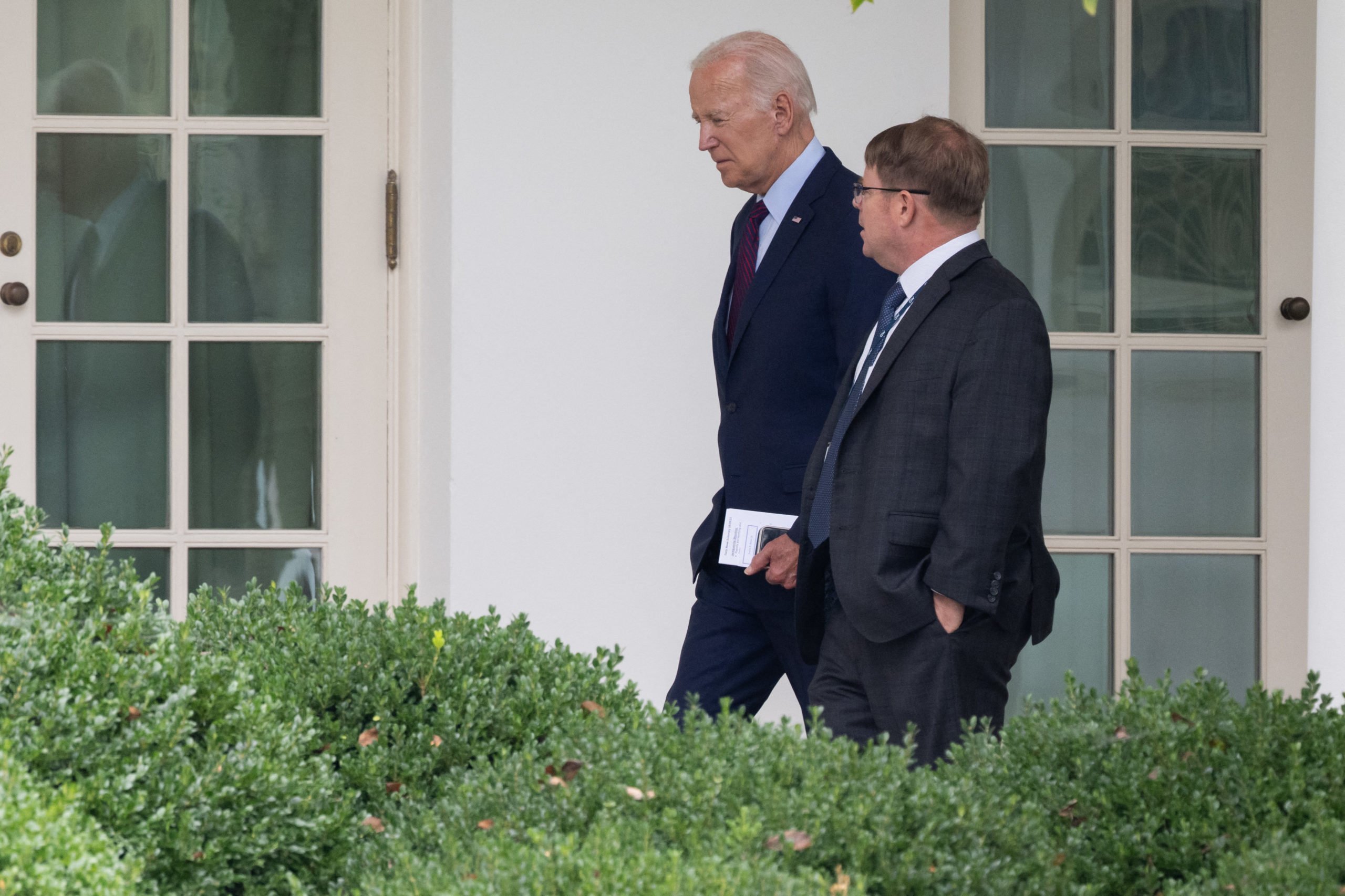 US President Joe Biden speaks with White House Physician Kevin O'Connor as he arrives back at the White House in Washington, DC, on August 28, 2023, following a visit to Eliot-Hine Middle School.(Photo by SAUL LOEB/AFP via Getty Images)
