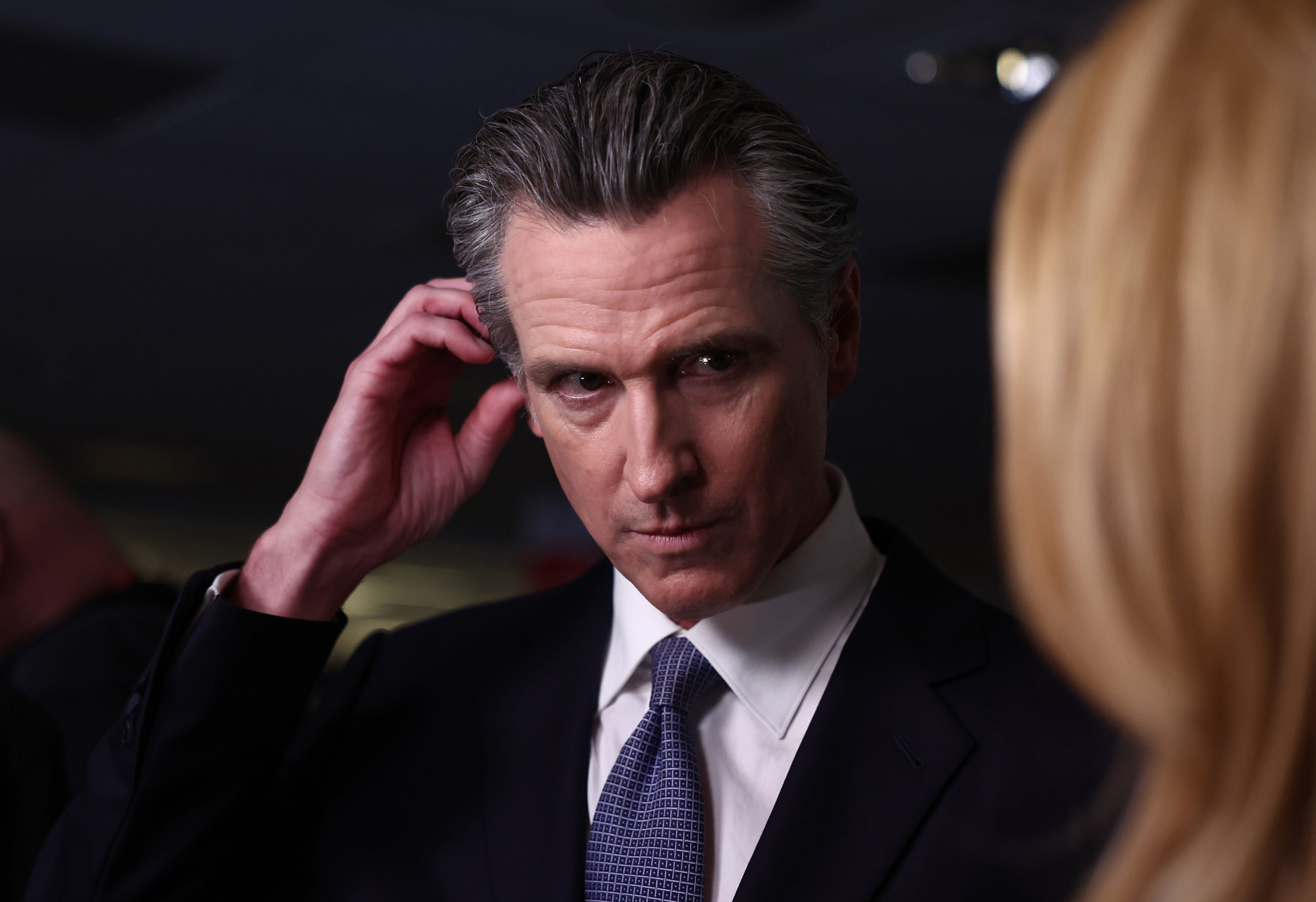 SIMI VALLEY, CALIFORNIA - SEPTEMBER 27: California Gov. Gavin Newsom talks to reporters in the spin room following the FOX Business Republican Primary Debate at the Ronald Reagan Presidential Library on September 27, 2023 in Simi Valley, California. Seven presidential hopefuls squared off in the second Republican primary debate as former U.S. President Donald Trump, currently facing indictments in four locations, declined again to participate. (Photo by Mario Tama/Getty Images)
