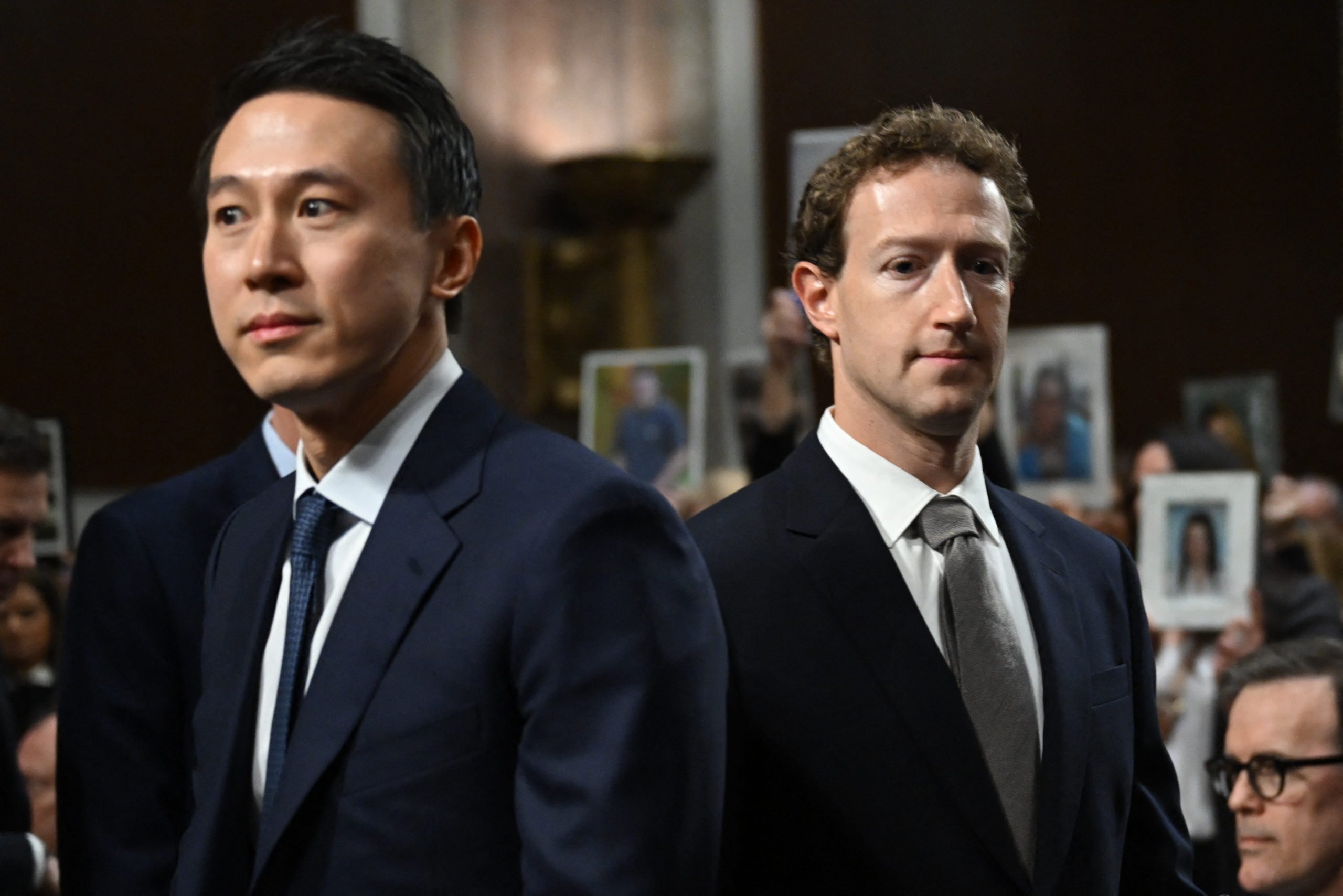 TOPSHOT - (L-R) Shou Zi Chew, CEO of TikTok and Mark Zuckerberg, CEO of Meta, arrive to testify before the US Senate Judiciary Committee hearing, "Big Tech and the Online Child Sexual Exploitation Crisis," in Washington, DC, on January 31, 2024. (Photo by ANDREW CABALLERO-REYNOLDS / AFP) (Photo by ANDREW CABALLERO-REYNOLDS/AFP via Getty Images)