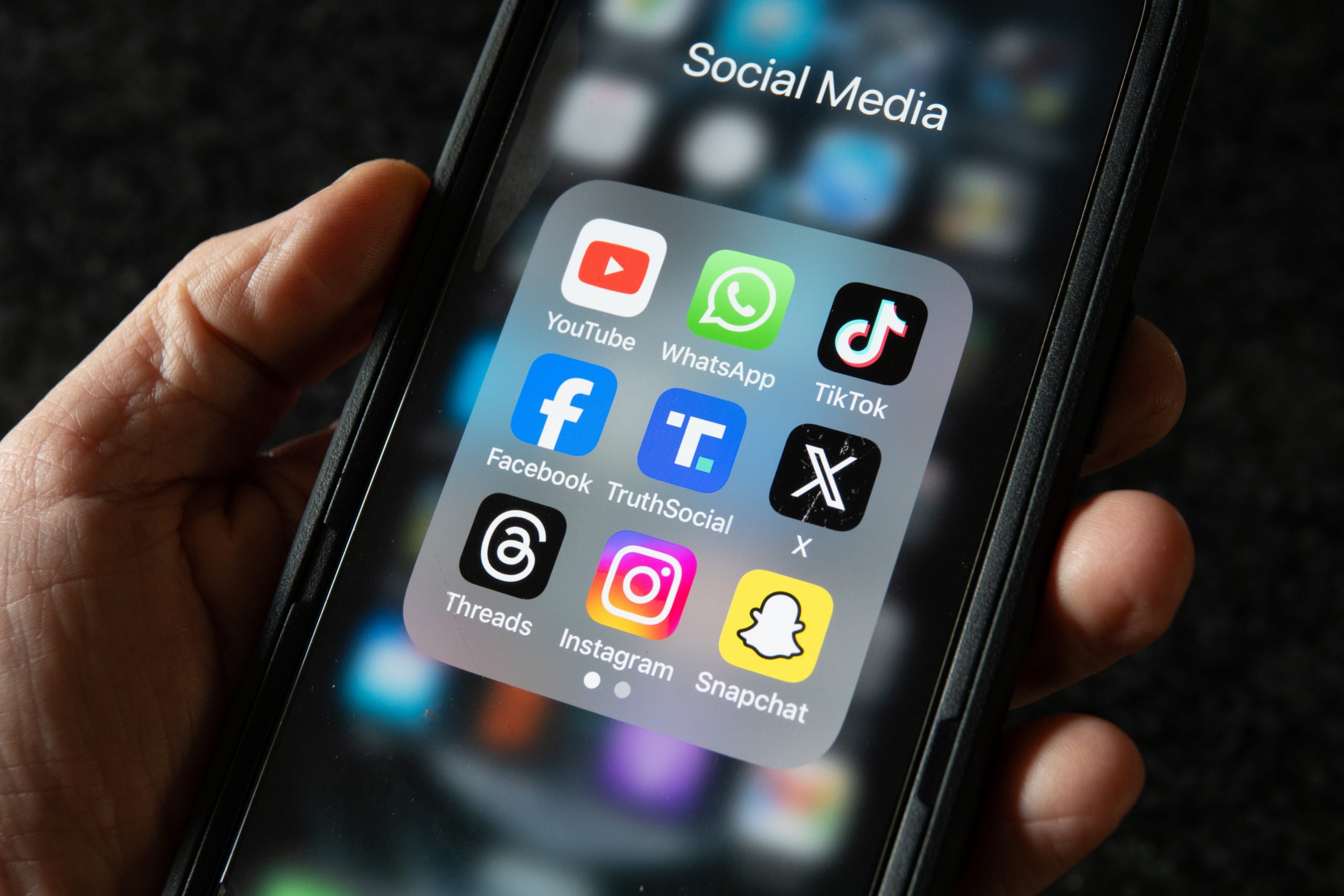  In this photo illustration a smartphone screen displays the logo of social media platforms. (Photo by Anna Barclay/Getty Images)
