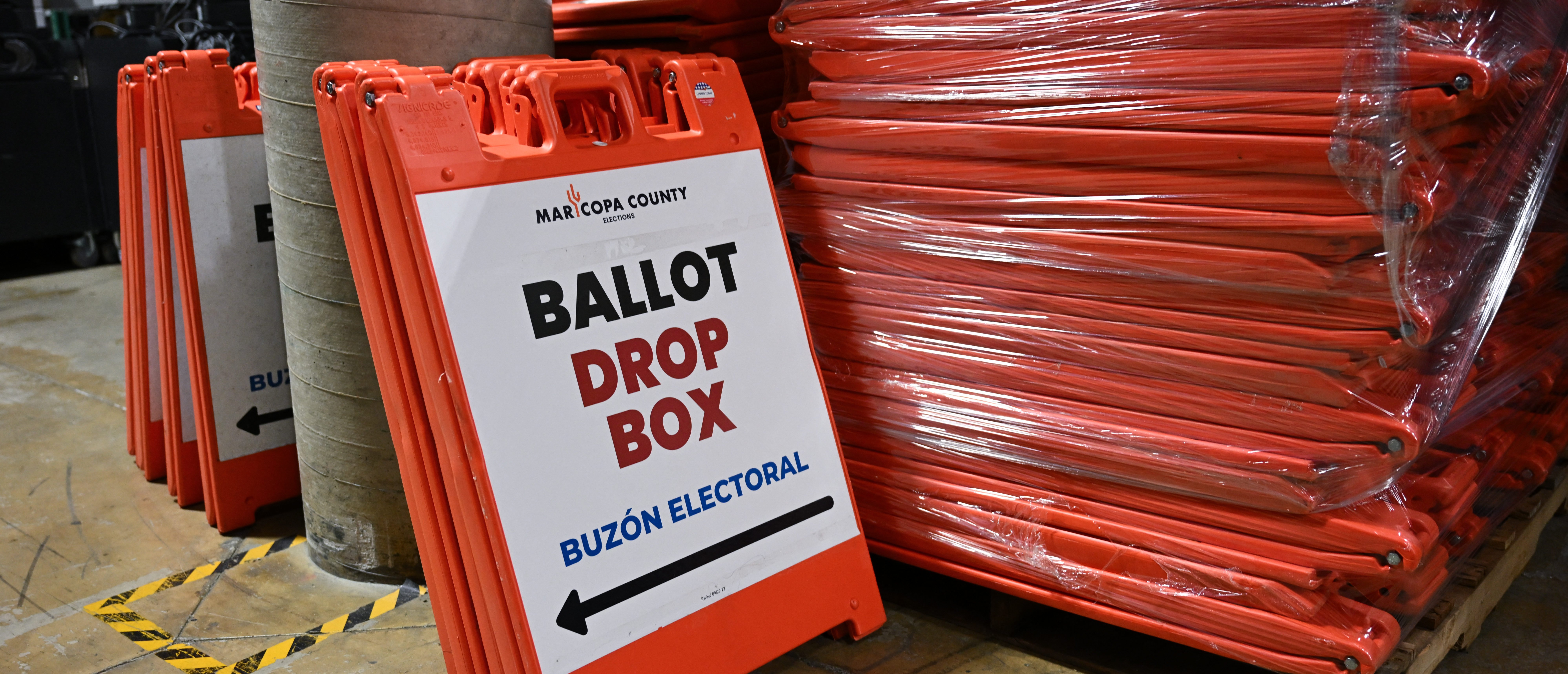 Stacks of ballot drop box signs sit in storage at the Maricopa County Tabulation and Election Center (MCTEC) ahead of the 2024 Arizona Primary and General elections in Phoenix, Arizona, on June 3, 2024. (Photo by PATRICK T. FALLON/AFP via Getty Images)