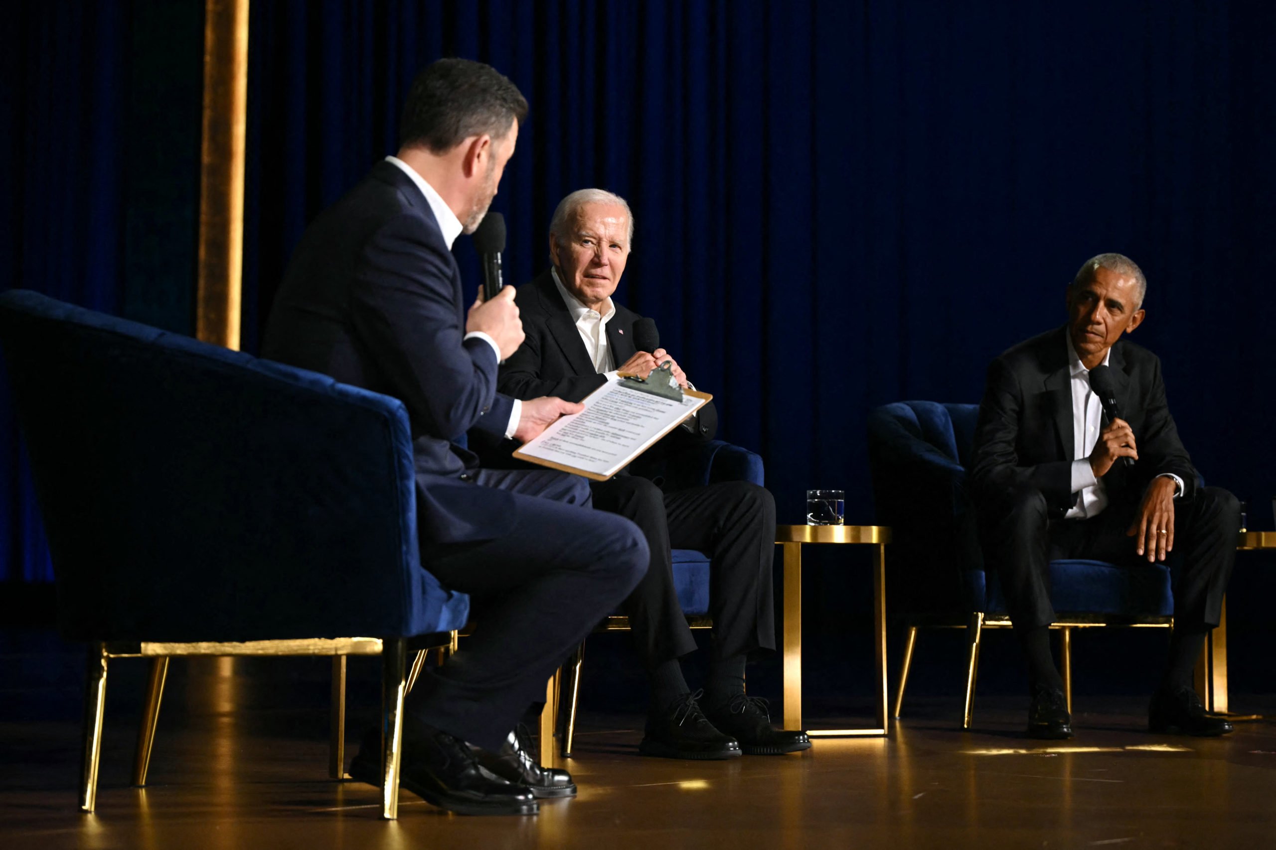 US President Joe Biden (C), US television host Jimmy Kimmel (L) and former US President Barack Obama sit onstage during a campaign fundraiser at the Peacock Theater in Los Angeles on June 15, 2024. (Photo by Mandel NGAN / AFP) (Photo by MANDEL NGAN/AFP via Getty Images)