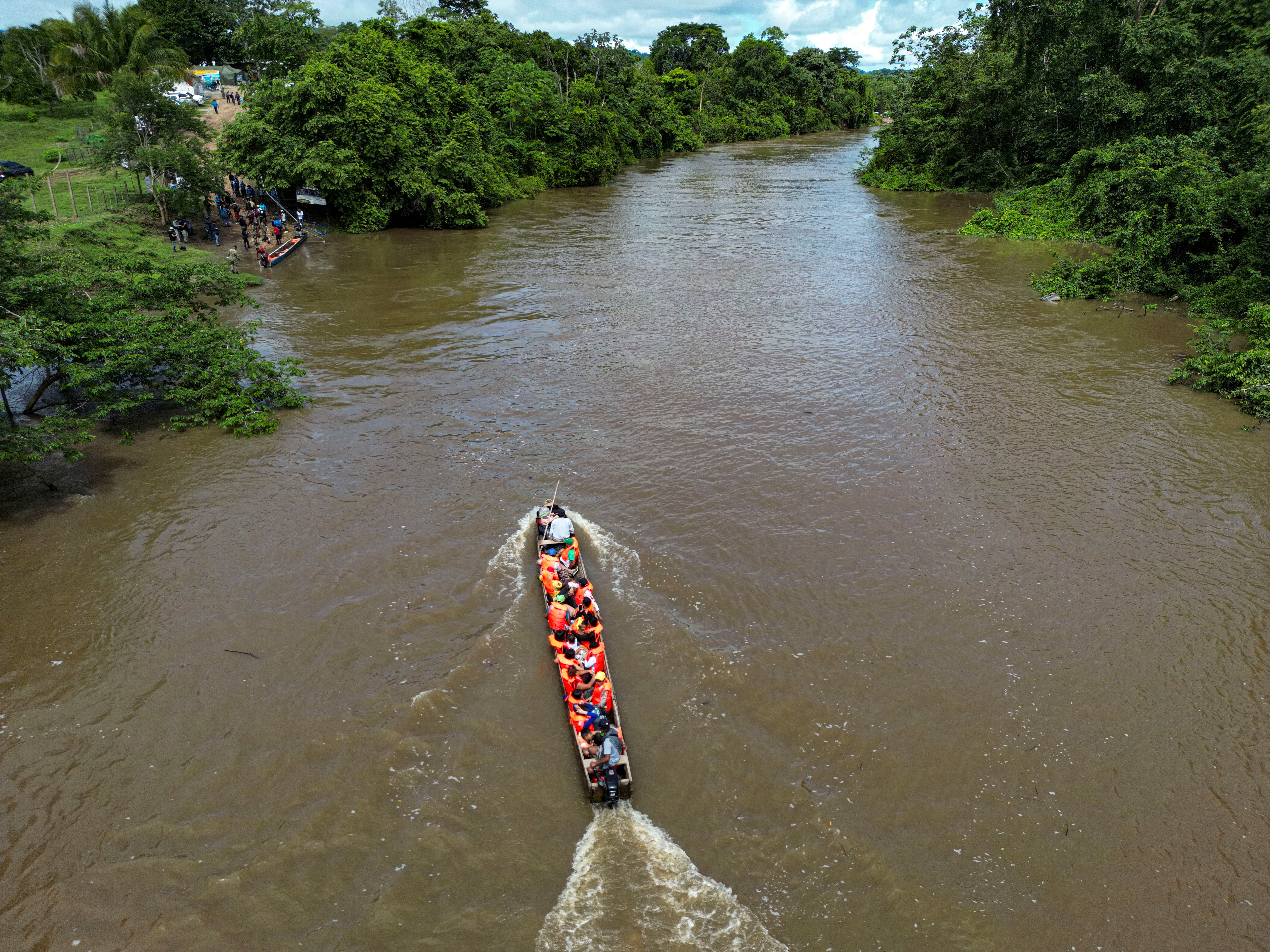 In this aerial view migrants arrive at the Reception Center for Migrant Care in Lajas Blancas, in the jungle province of Darien, Panama, on June 28, 2024. Panama's president-elect, Jose Raul Mulino, has pledged to close the dangerous Darien Gap, a crucial corridor for migrants from South America, Central America, and Mexico, who seek better opportunities in the United States. Mulino is set to take office on July 1. (Photo by MARTIN BERNETTI/AFP via Getty Images)