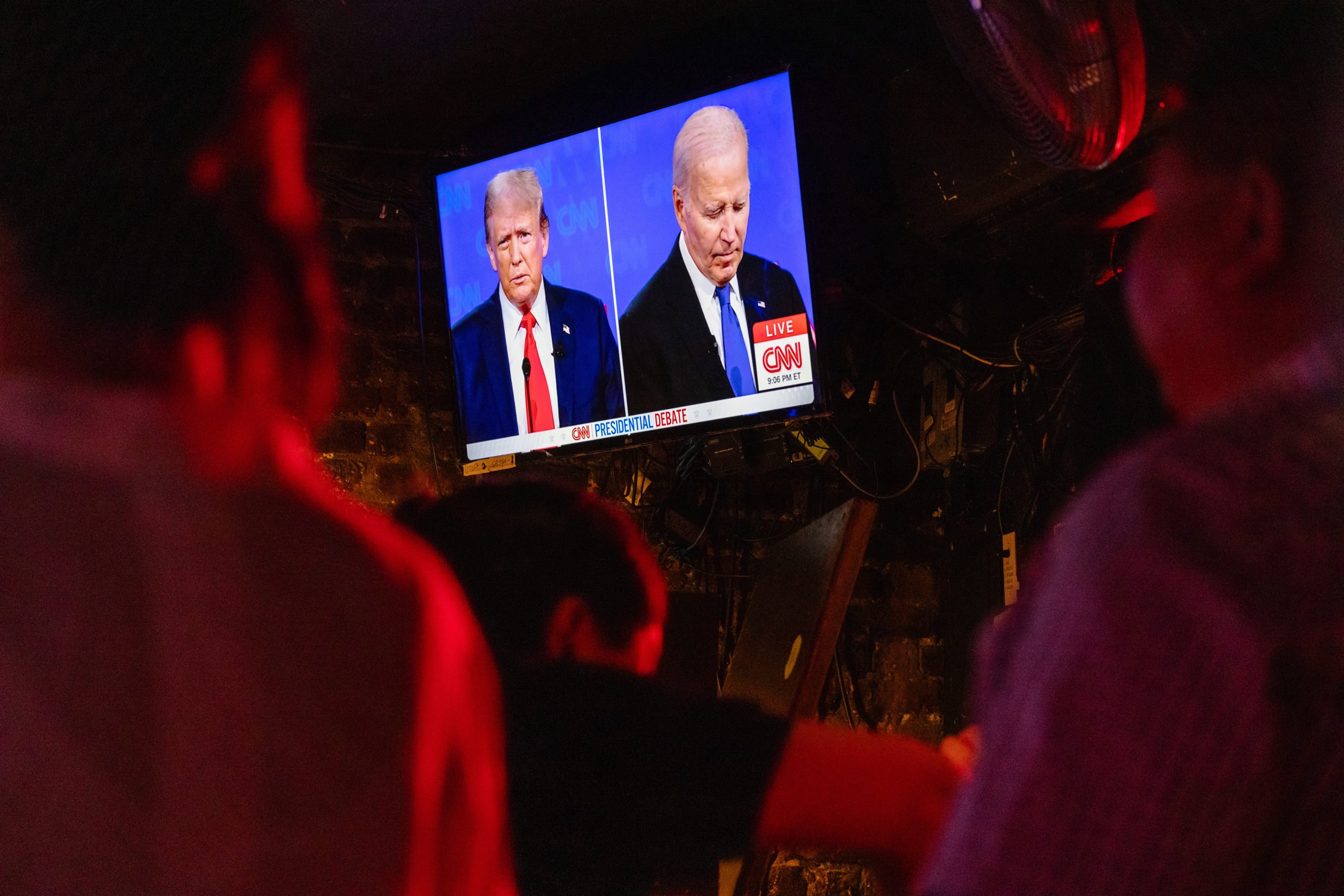 People watch the presidential debate between U.S. President Joe Biden and presumptive Republican nominee, former President Donald Trump at Wicked Willy's on June 27, 2024 in New York City. (Photo by Michael M. Santiago/Getty Images)