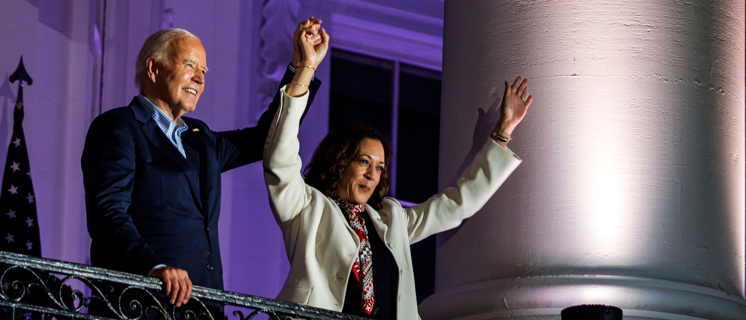 President Joe Biden and Vice President Kamala Harris join hands in the air after watching the fireworks on the National Mall with First Lady Jill Biden and Second Gentleman Doug Emhoff from the White House balcony during a 4th of July event on the South Lawn of the White House on July 4, 2024 in Washington, DC. The President is hosting the Independence Day event for members of the military and their families. (Photo by Samuel Corum/Getty Images)