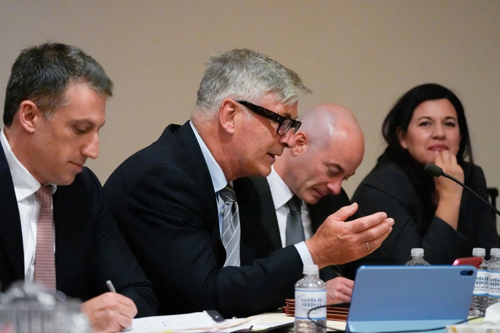 (From L) Lawyer Alex Spiro, US actor Alec Baldwin, lawyer Luke Nikas and lawyer Heather LeBlanc participate in a pretrial hearing in Santa Fe, New Mexico, on July 8, 2024. Baldwin is facing a single charge of involuntary manslaughter in the death of a cinematographer. In October 2021, on the New Mexico set of his low-budget Western "Rust," a gun pointed by Baldwin discharged a live round, killing the film's cinematographer Halyna Hutchins and wounding its director. (Photo by Ross D. Franklin / POOL / AFP) (Photo by ROSS D. FRANKLIN/POOL/AFP via Getty Images)