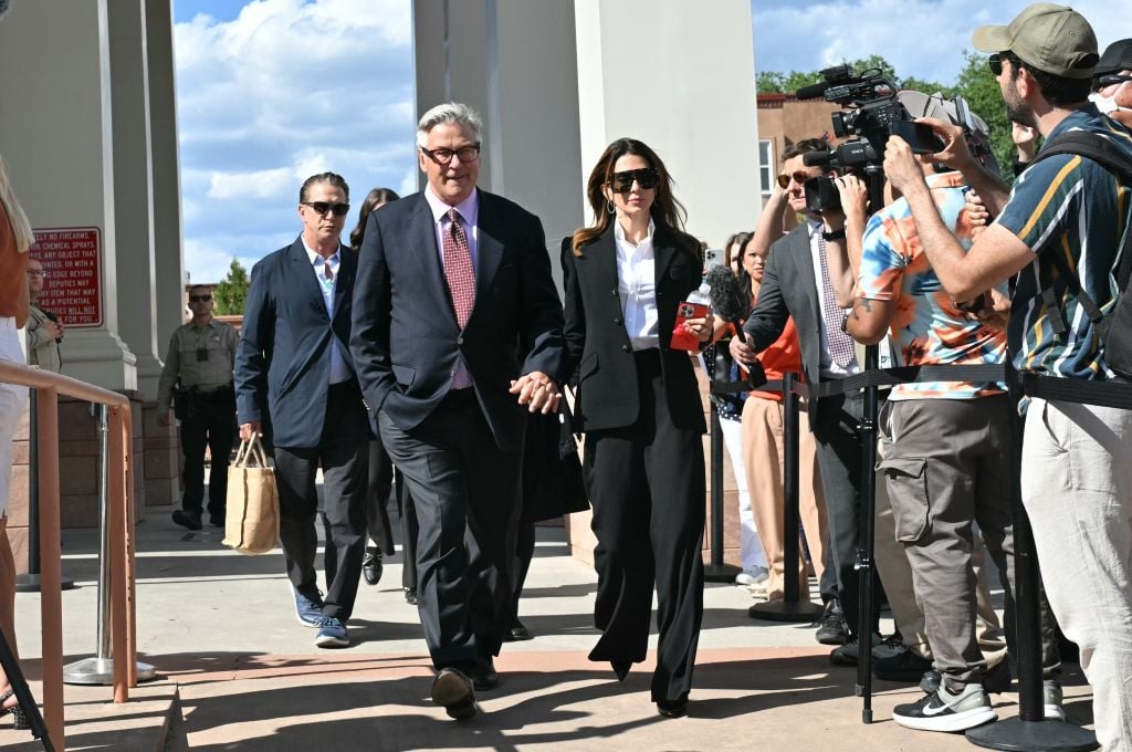 US actor Alec Baldwin and his wife Hilaria Baldwin leave the courthouse after the first hearing in his trial for involuntary manslaughter in Santa Fe, New Mexico, on July 10, 2024. Baldwin was accused of violating basic gun safety rules and playing "make believe" with a deadly weapon, as the Hollywood star's trial for involuntary manslaughter over a fatal shooting on the set of Western movie "Rust" began Wednesday. (Photo by Frederic J. Brown / AFP) (Photo by FREDERIC J. BROWN/AFP via Getty Images)