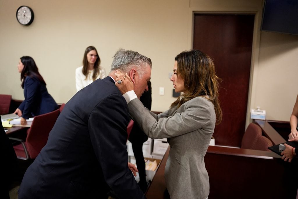 US actor Alec Baldwin and his wife Hilaria Baldwin embrace during his trial on involuntary manslaughter at Santa Fe County District Court in Santa Fe, New Mexico, on July 12, 2024. Baldwin's trial for involuntary manslaughter was dismissed by a judge Friday after she ruled that key evidence over a fatal shooting on the set of "Rust" had been withheld from the defense. (Photo by RAMSAY DE GIVE / POOL / AFP) (Photo by RAMSAY DE GIVE/POOL/AFP via Getty Images)