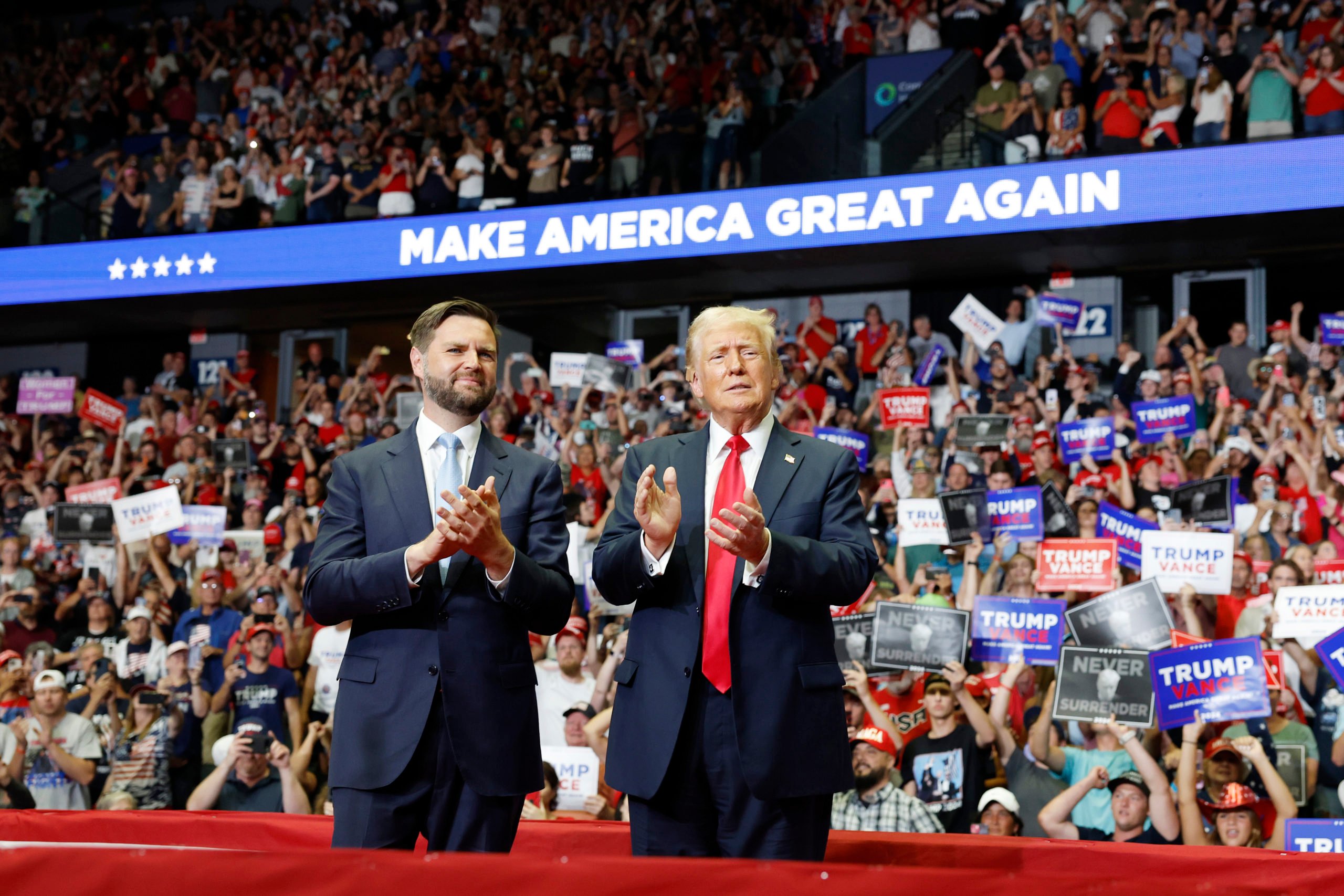 Republican presidential nominee, former U.S. President Donald Trump stands onstage with Republican vice presidential candidate, Sen. J.D. Vance (R-OH) during a campaign rally. (Photo by Anna Moneymaker/Getty Images)