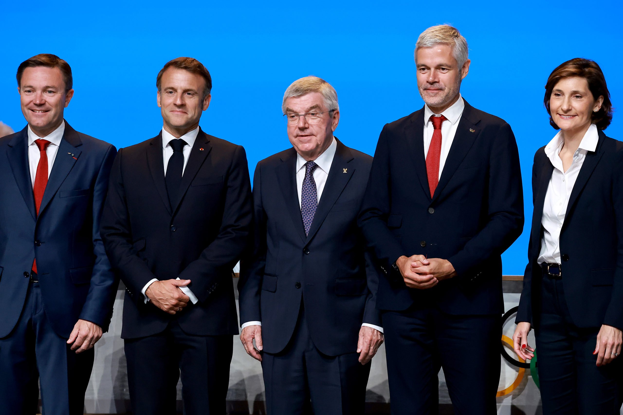 French Alps 2030 delegation members poses with International Olympic Committee (IOC) President Thomas Bach and French President Emmanuel Macron. (Photo by Arturo Holmes/Getty Images)
