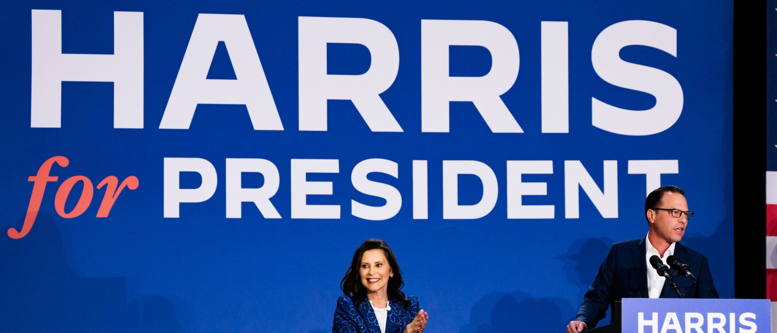 AMBLER, PENNSYLVANIA - JULY 29: Michigan Governor Gretchen Whitmer applauds as Pennsylvania Governor Josh Shapiro speaks during a campaign rally for Vice President Kamala Harris on July 29, 2024 in Ambler, Pennsylvania. Shapiro and Whitmer campaigned to bring supporters behind Vice President Harris's campaign to protect Americans' freedoms, lower costs for families, and slam Trump's Project 2025 agenda. (Photo by Hannah Beier/Getty Images)