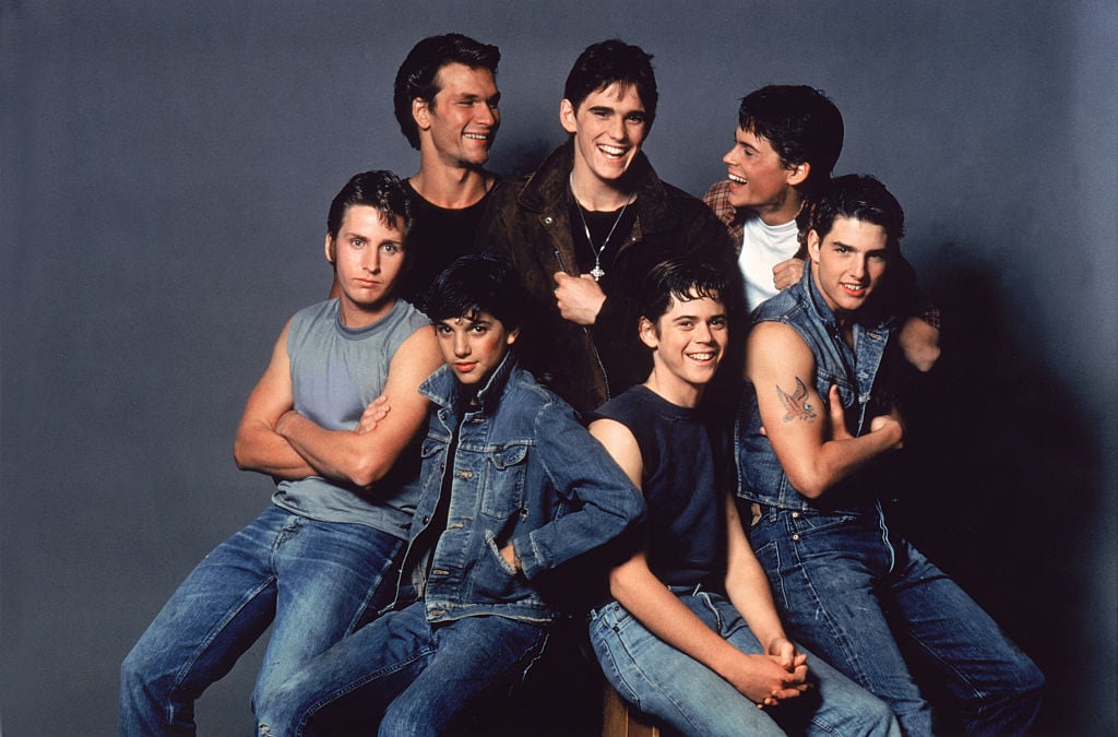American actors Patrick Swayze, Matt Dillon, Rob Lowe, Emilio Estevez, Ralph Macchio, Thomas C. Howell, and Tom Cruise on the set of The Outsiders, directed by Francis Ford Coppola. (Photo by Sunset Boulevard/Corbis via Getty Images)
