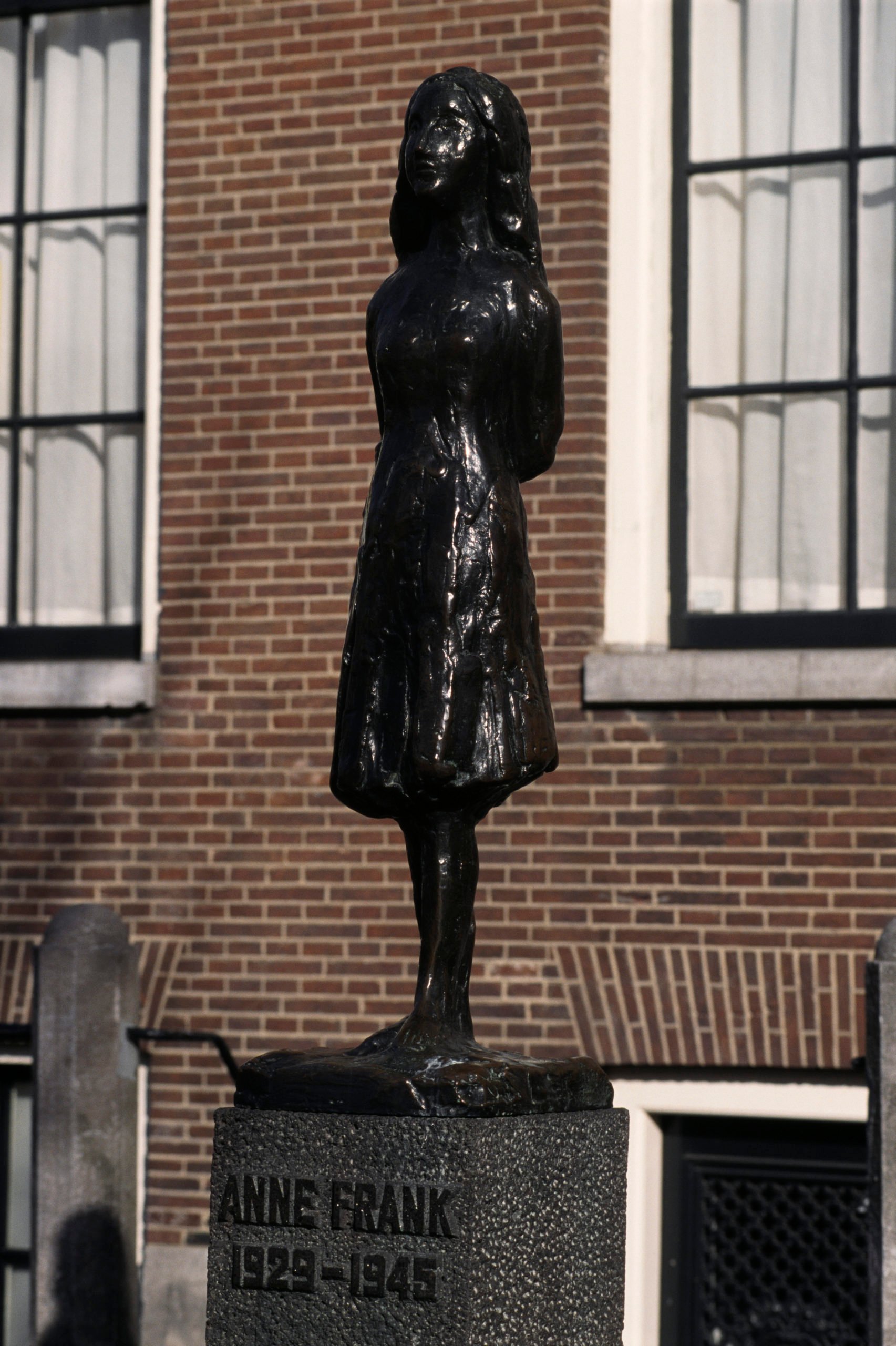 A statue of Anne Frank in Westermarkt, near the house where Anne Frank and her family hid during the war. | Located in: Westermarkt. (Photo by David Lefranc/Kipa/Sygma via Getty Images)