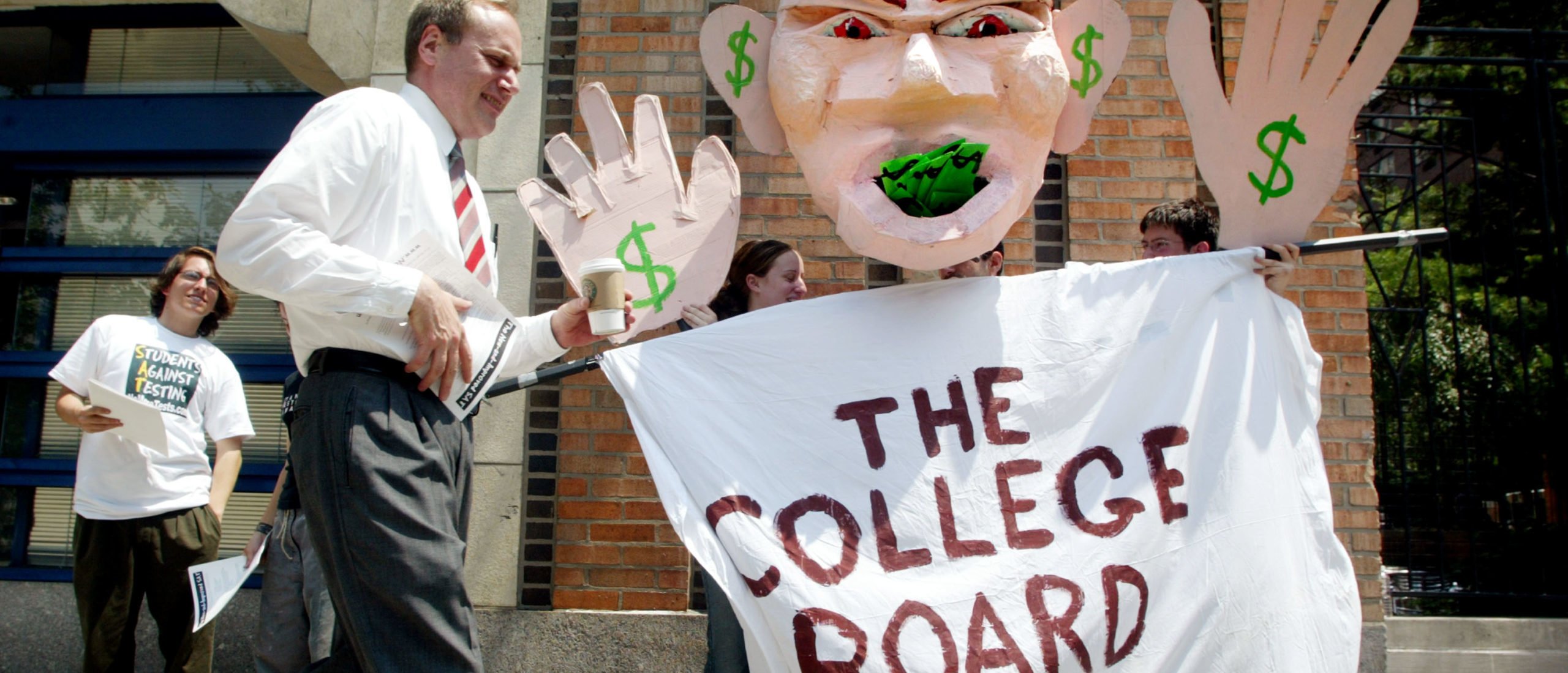 NEW YORK - JUNE 27: Students protest SAT testing outside College Board headquarters June 27, 2002 in New York City. College Board trustees decided June 27 to add a written essay and other changes to the SAT in an overhaul of the college entrance exam. (Photo by Mario Tama/Getty Images)