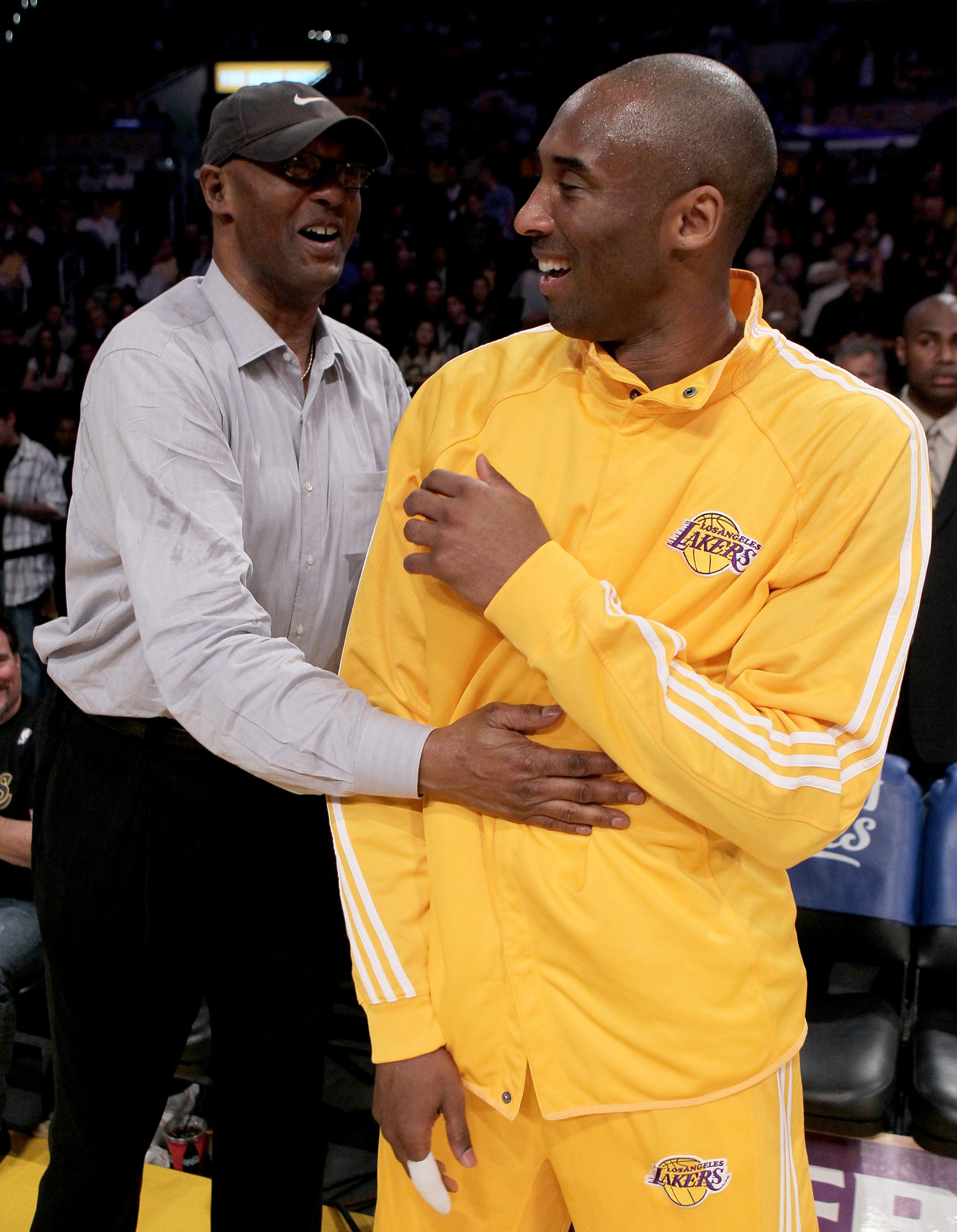 LOS ANGELES - APRIL 20: Kobe Bryant #24 of the Los Angeles Lakers laughs with father Joe Jelly Bean Bryant before playing the Oklahoma City Thunder during Game Two of the Western Conference Quarterfinals of the 2010 NBA Playoffs on April 20, 2010 at Staples Center in Los Angeles, California. NOTE TO USER: User expressly acknowledges and agrees that, by downloading and/or using this Photograph, user is consenting to the terms and conditions of the Getty Images License Agreement. (Photo by Stephen Dunn/Getty Images)