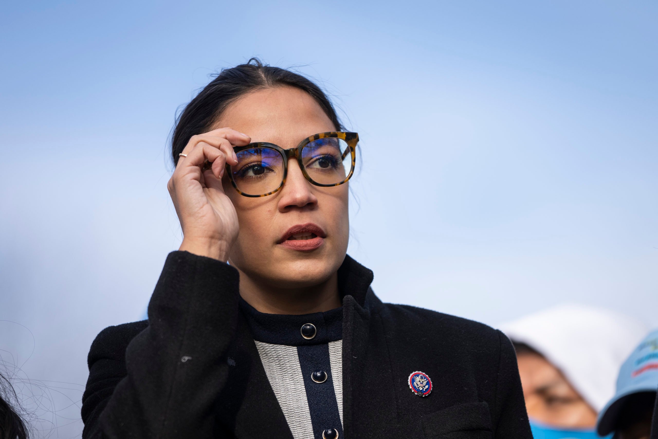 WASHINGTON, DC - DECEMBER 7: Rep. Alexandria Ocasio-Cortez (D-NY) prepares to speak during a rally for immigration provisions to be included in the Build Back Better Act outside the U.S. Capitol December 7, 2021 in Washington, DC. Progressive Democrats are urging the Senate to include a pathway to citizenship for undocumented immigrants living in the U.S. in the Build Back Better Act. Drew Angerer/Getty Images