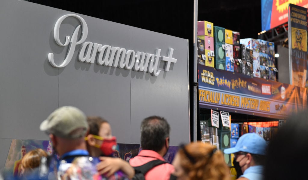 Attendees walk by the booth for the Paramount+ streaming service during San Diego Comic-Con International in San Diego, California, on July 24, 2022. (Photo by Chris Delmas / AFP) (Photo by CHRIS DELMAS/AFP via Getty Images)