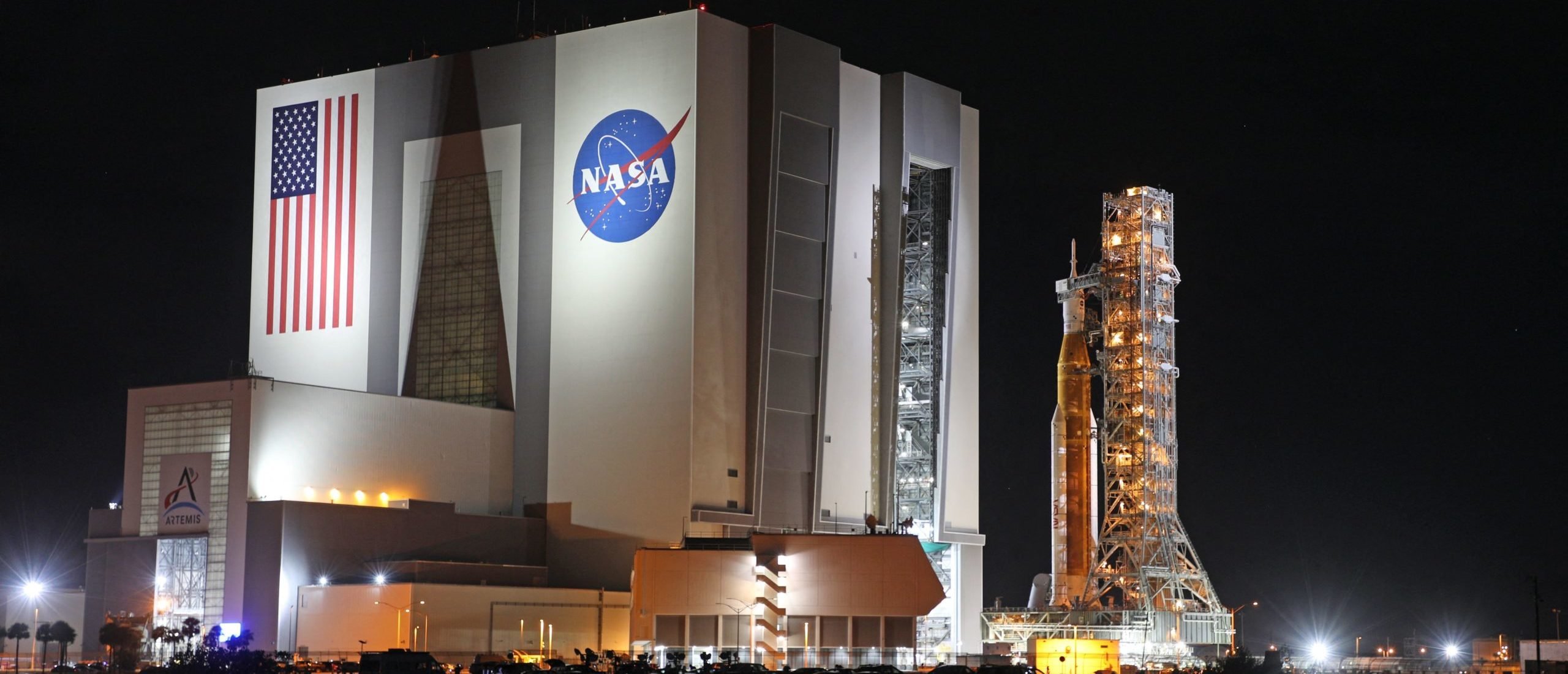 The Artemis-1 rocket is rolled out from the Vehicle Assembly Building en route to Launch Pad 39B shortly after midnight at the Kennedy Space Center in Florida on November 3, 2022. - NASA officials aim to launch the massive rocket on November 14 after two previous aborted launch attempts. Artemis-1 is scheduled to journey around the far side of the Moon after launching on a mission lasting four to six weeks before returning home faster and hotter than any vessel before. The mission objectives for this first flight of the Space Launch System (SLS) rocket and Orion spacecraft are to demonstrate its flight worthiness and the ability of Orion's heat shield in lunar reentry conditions. The launch and flight tests must be completed before returning astronauts to the lunar surface for the first time since 1972. (Photo by GREGG NEWTON/AFP via Getty Images)