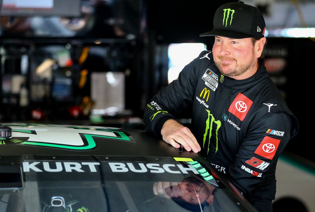 HAMPTON, GEORGIA - MARCH 19: Kurt Busch, driver of the #45 Monster Energy Toyota, enters his car in the garage area during practice for the NASCAR Cup Series Folds of Honor QuikTrip 500 at Atlanta Motor Speedway on March 19, 2022 in Hampton, Georgia. (Photo by Mike Mulholland/Getty Images)