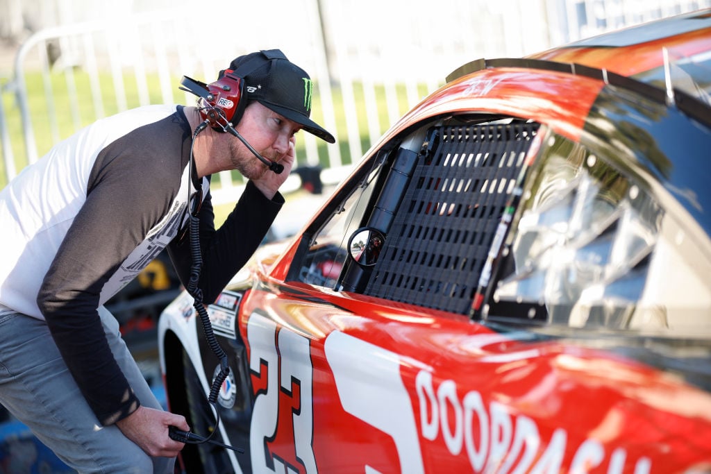 LOS ANGELES, CALIFORNIA - FEBRUARY 04: Retired NASCAR driver Kurt Busch and advisor to 23XI Racing speaks to Bubba Wallace, driver of the #23 DoorDash Toyota, during practice for the NASCAR Clash at the Coliseum at Los Angeles Coliseum on February 04, 2023 in Los Angeles, California. (Photo by Jared C. Tilton/Getty Images)