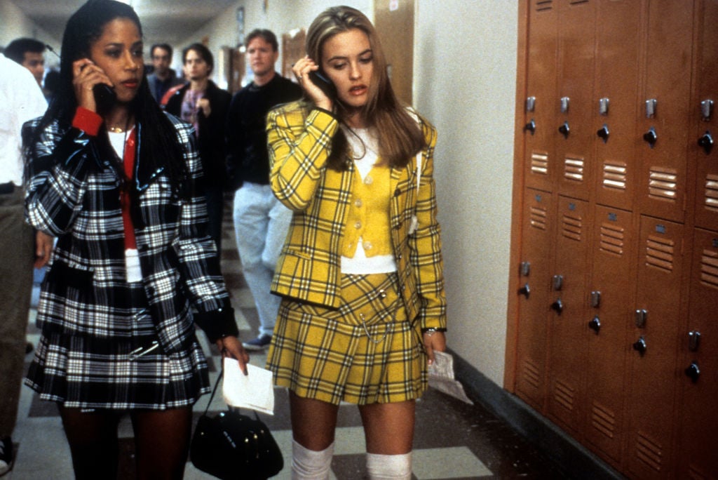 Stacey Dash and Alicia Silverstone walk and talk on the phone in a scene from the film 