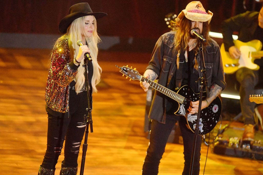 NASHVILLE, TENNESSEE - AUGUST 23: (L-R) FIREROSE and Billy Ray Cyrus perform onstage during the 16th Annual Academy of Country Music Honors at Ryman Auditorium on August 23, 2023 in Nashville, Tennessee. (Photo by Jason Davis/Getty Images for ACM)