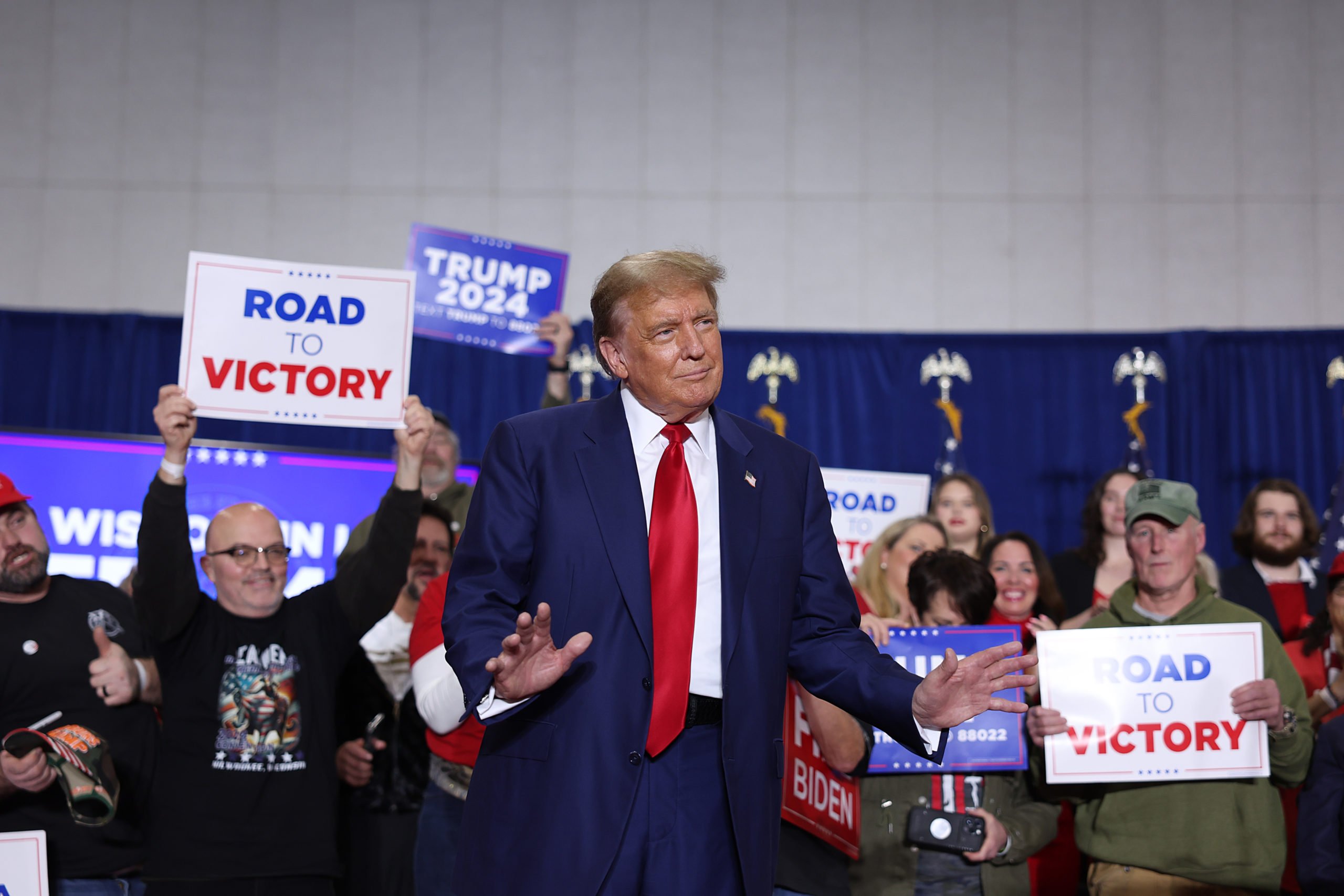 GREEN BAY, WISCONSIN - APRIL 02: Former President Donald Trump arrives for a rally on April 02, 2024 in Green Bay, Wisconsin. At the rally, Trump spoke next to an empty lectern on the stage and challenged President Joe Biden to debate him. The Wisconsin primary is being held today. (Photo by Scott Olson/Getty Images)