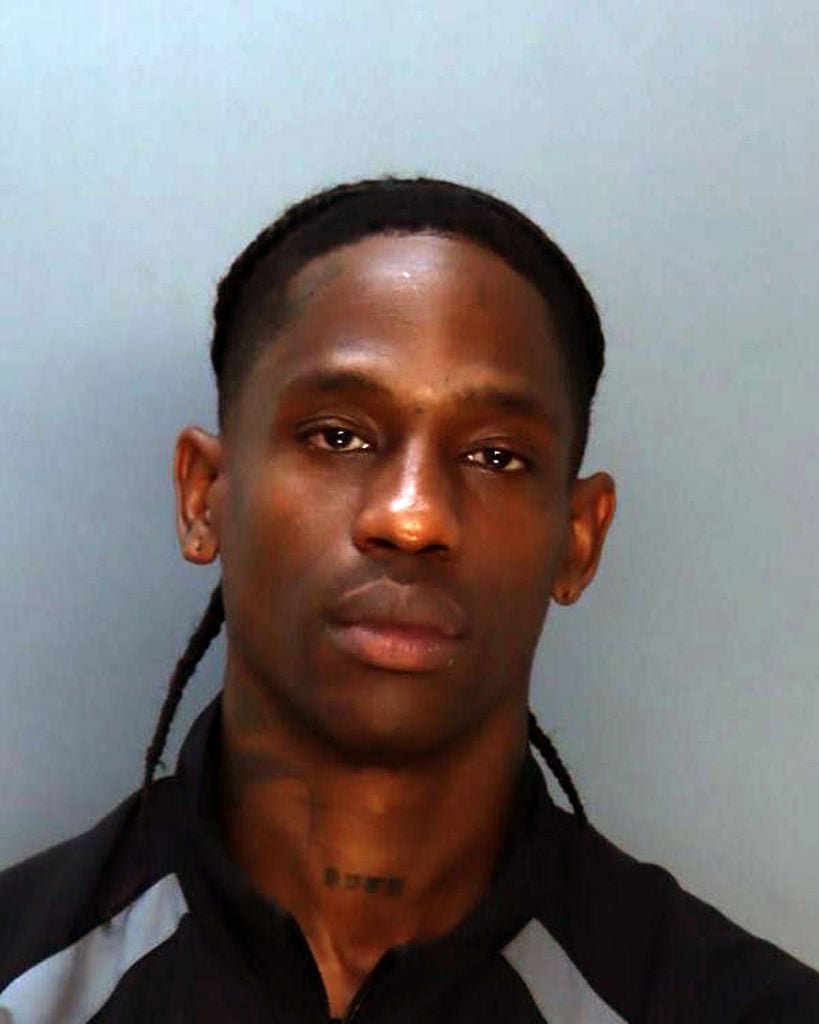 MIAMI, FL - JUNE 20: (EDITOR’S NOTE: This Handout image was provided by a third-party organization and may not adhere to Getty Images’ editorial policy.) In this handout image provided by the Miami-Dade County Corrections and Rehabilitation, Jacques Bermon Webster II, known professionally as Travis Scott poses for a booking photo on June 20, 2024 in Miami, Florida. The US rapper, singer, songwriter, and record producer was arrested after a verbal altercation with people on a yacht at the Miami Beach Marina, according to the arrest report. (Photo by Miami-Dade County Corrections and Rehabilitation via Getty Images)