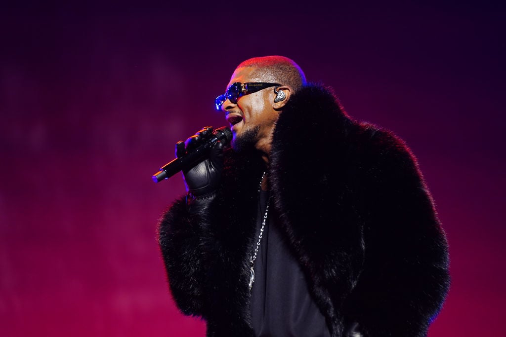 NEW ORLEANS, LOUISIANA - JULY 06: Usher performs onstage during Day 2 of the 2024 ESSENCE Festival of Culture presented by Coca-Cola at Caesars Superdome on July 06, 2024 in New Orleans, Louisiana. (Photo by Bennett Raglin/Getty Images for ESSENCE)