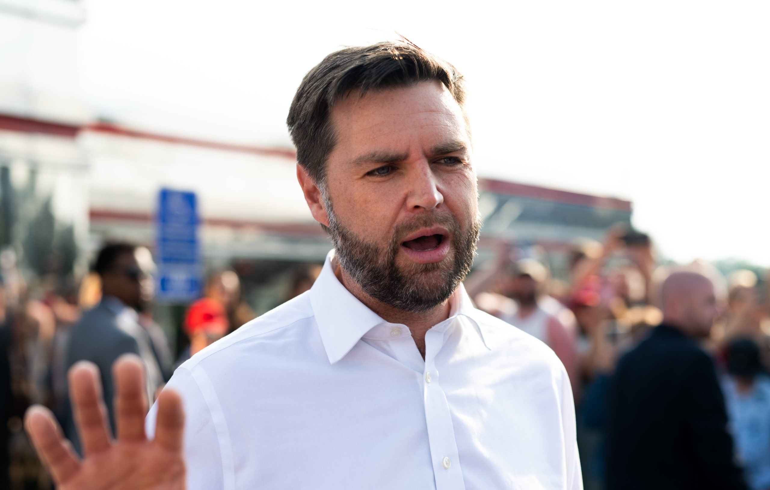 ST CLOUD, MINNESOTA - JULY 28: Republican vice presidential nominee U.S. Sen. J.D. Vance (R-OH) speaks with media gathered outside the Park Diner on July 28, 2024 in St Cloud, Minnesota. Vance joined U.S. Republican Presidential nominee former President Donald Trump for a campaign rally last night in Minnesota. (Photo by Stephen Maturen/Getty Images)