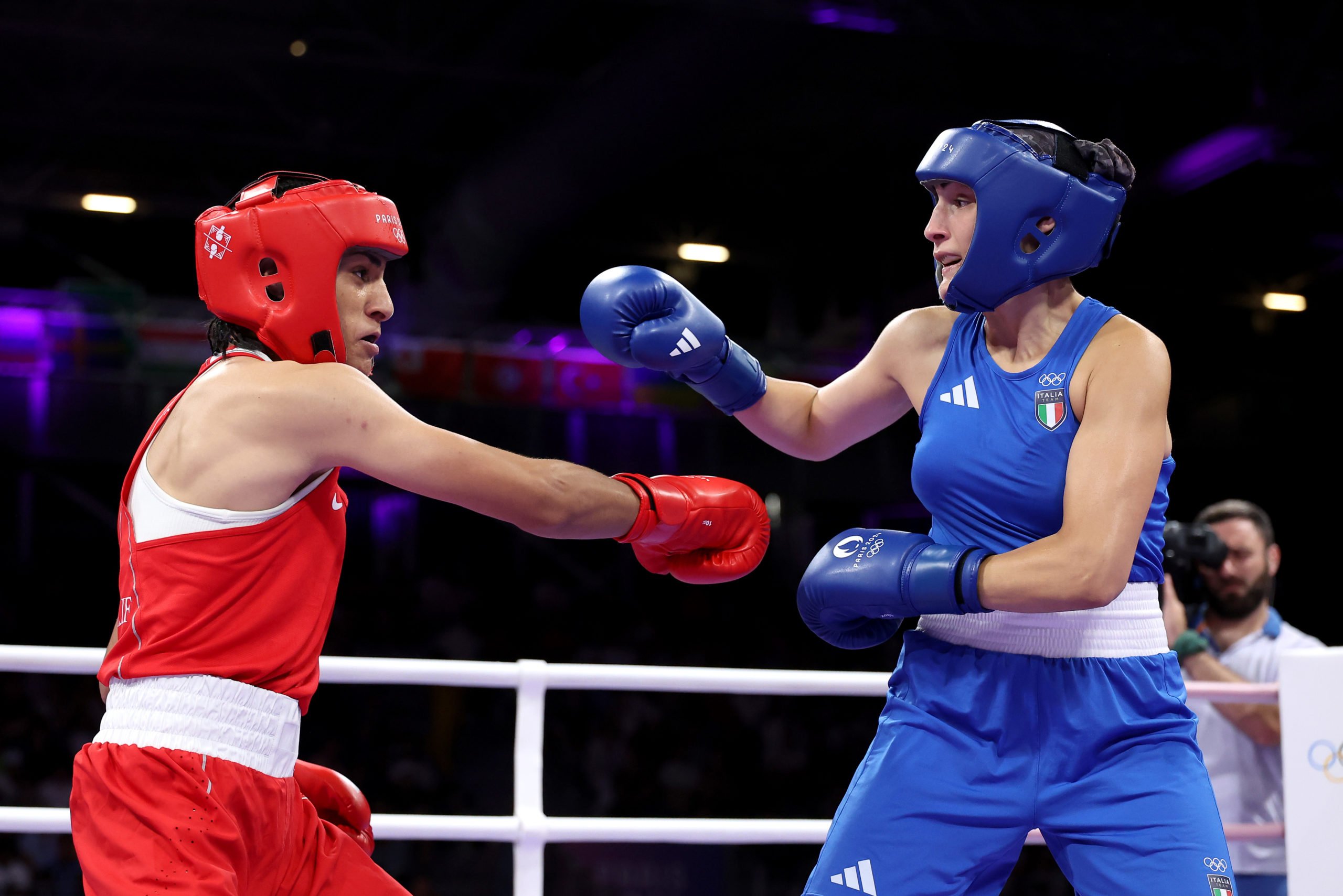 PARIS, FRANCE - AUGUST 01: Imane Khelif of Team Algeria and Angela Carini of Team Italy exchange punches during the Women's 66kg preliminary round match on day six of the Olympic Games Paris 2024 at North Paris Arena on August 01, 2024 in Paris, France. (Photo by Richard Pelham/Getty Images)